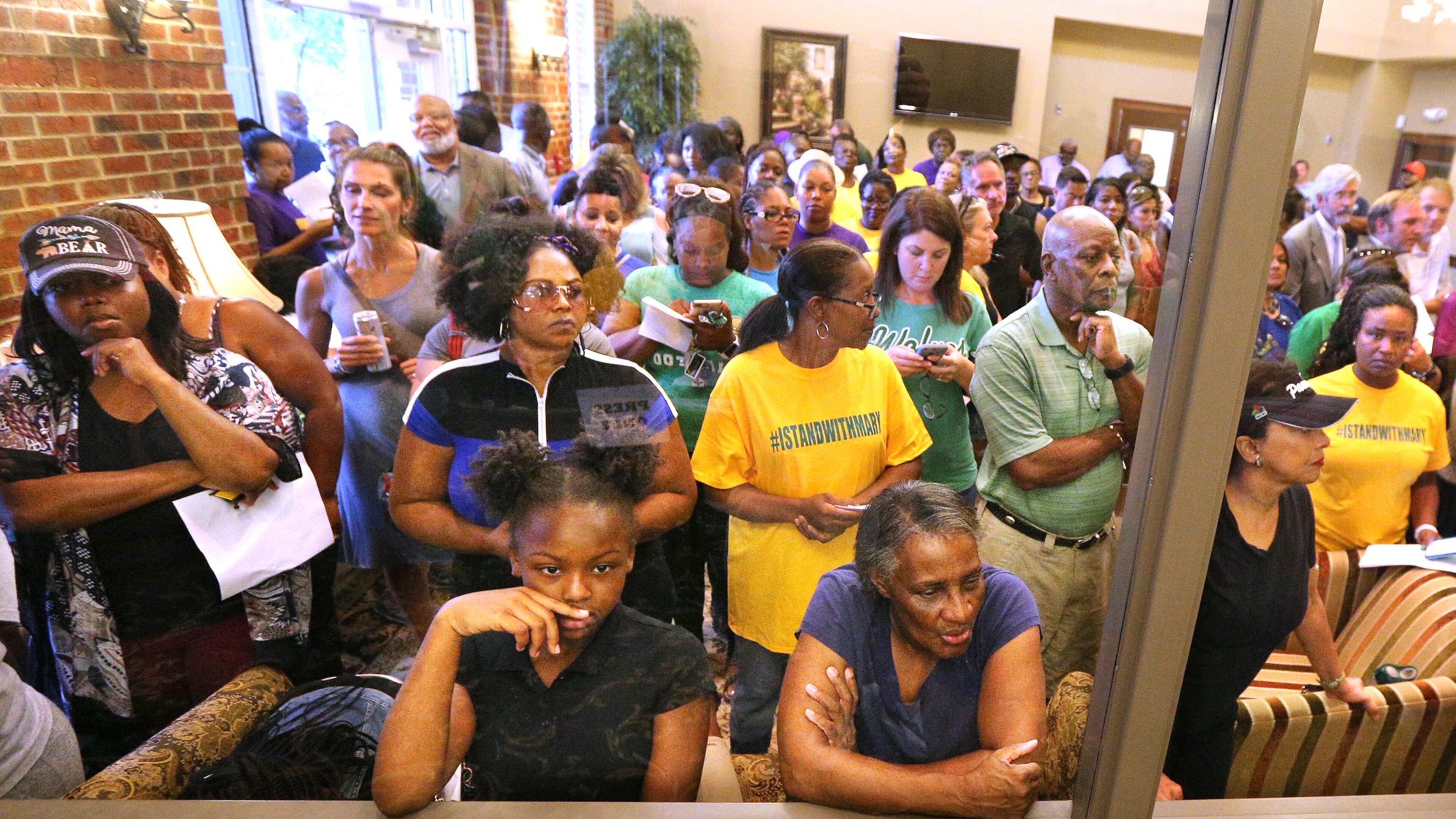 An overflow crowd attended the first Buford Board of Education meeting after an audio recording surfaced of a person using racial slurs to refer to black temporary construction workers and threatening them. The speaker on the tape was said to be Superintendent Geye Hamby, who soon resigned. CURTIS COMPTON/CCOMPTON@AJC.COM