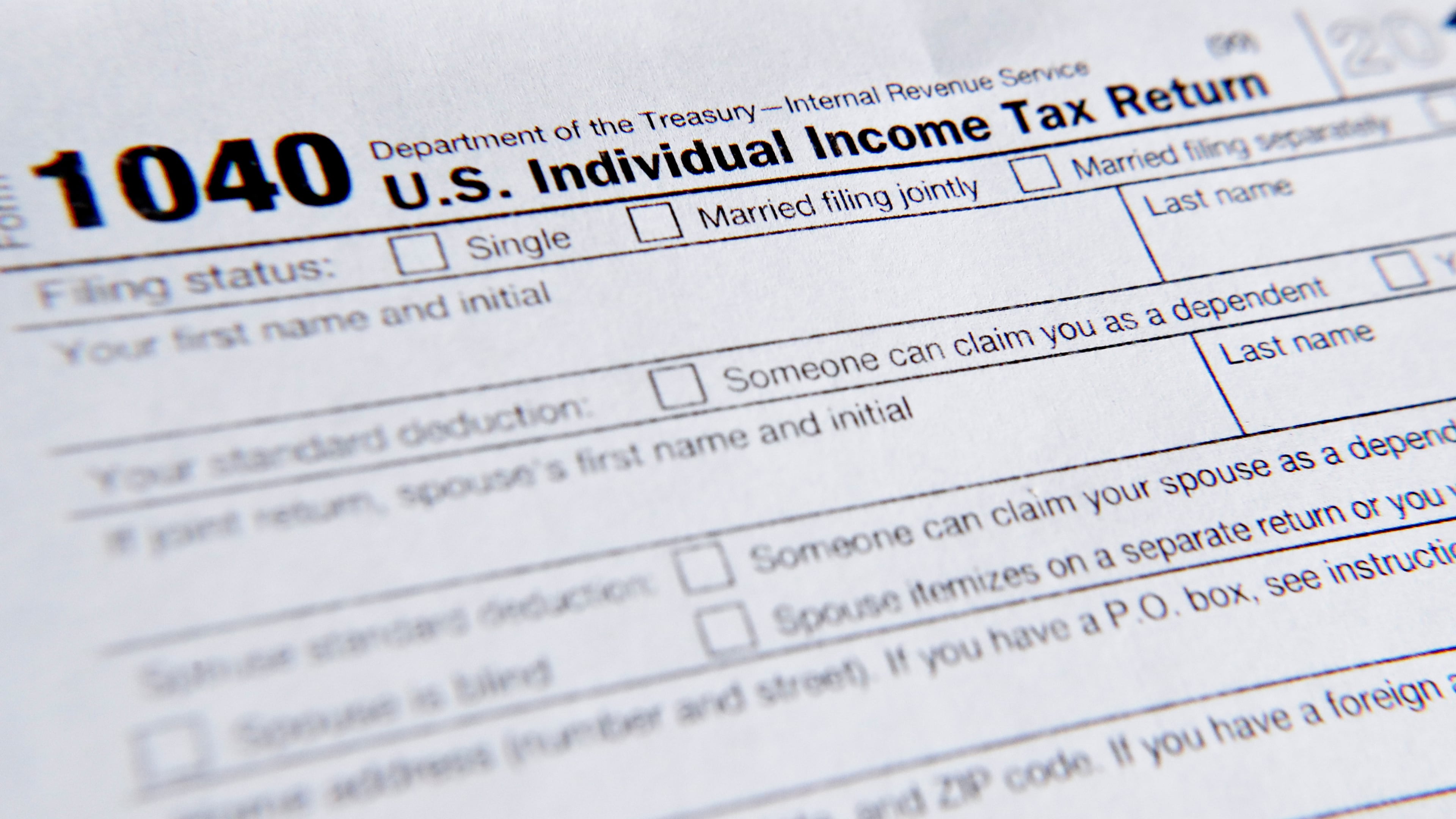 FILE - A 1040 tax form printed from the Internal Revenue Service web page is seen, Feb. 13, 2019, in Zelienople, Pa. (AP Photo/Keith Srakocic, File)