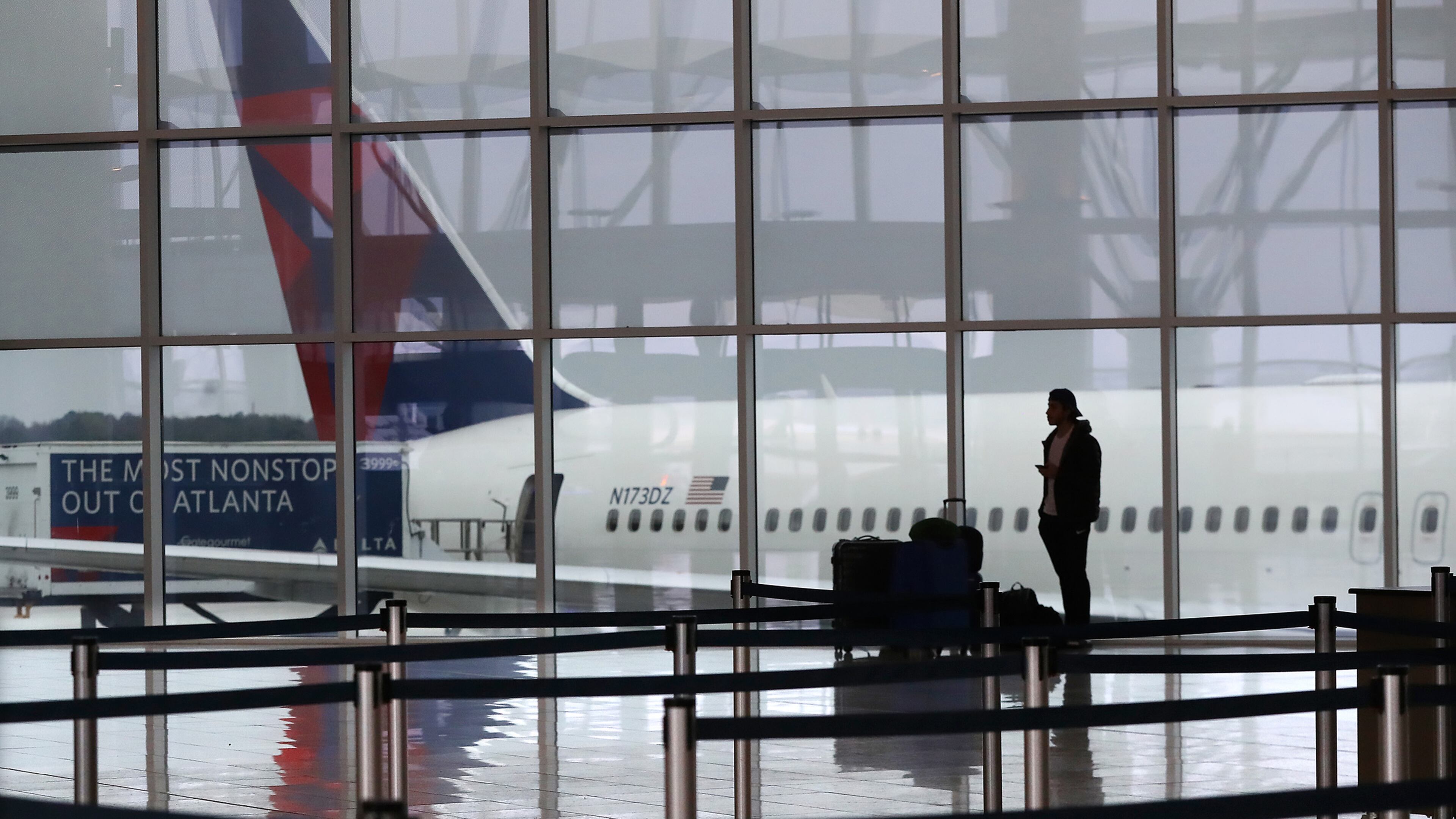 A Delta plane sits at the International Terminal at Atlanta's Hartsfield-Jackson International Airport in March 2020. (Curtis Compton/Atlanta Journal-Constitution/TNS)