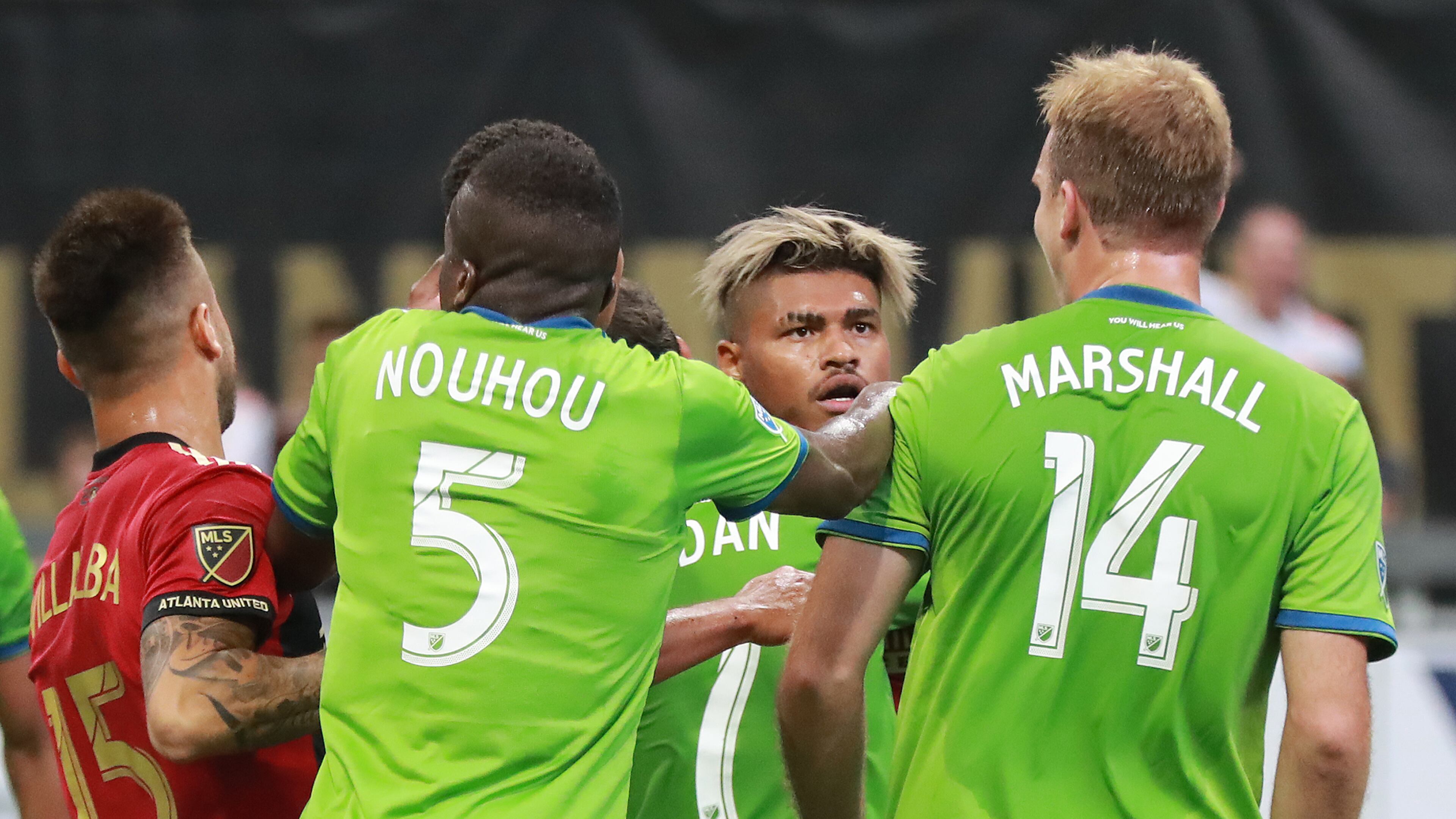 Atlanta United striker Josef Martinez gets into a scuffle with Seattle Sounders Chad Marshall during the first half in a MLS soccer game on Sunday, July 15, 2018, in Atlanta. Curtis Compton/ccompton@ajc.com