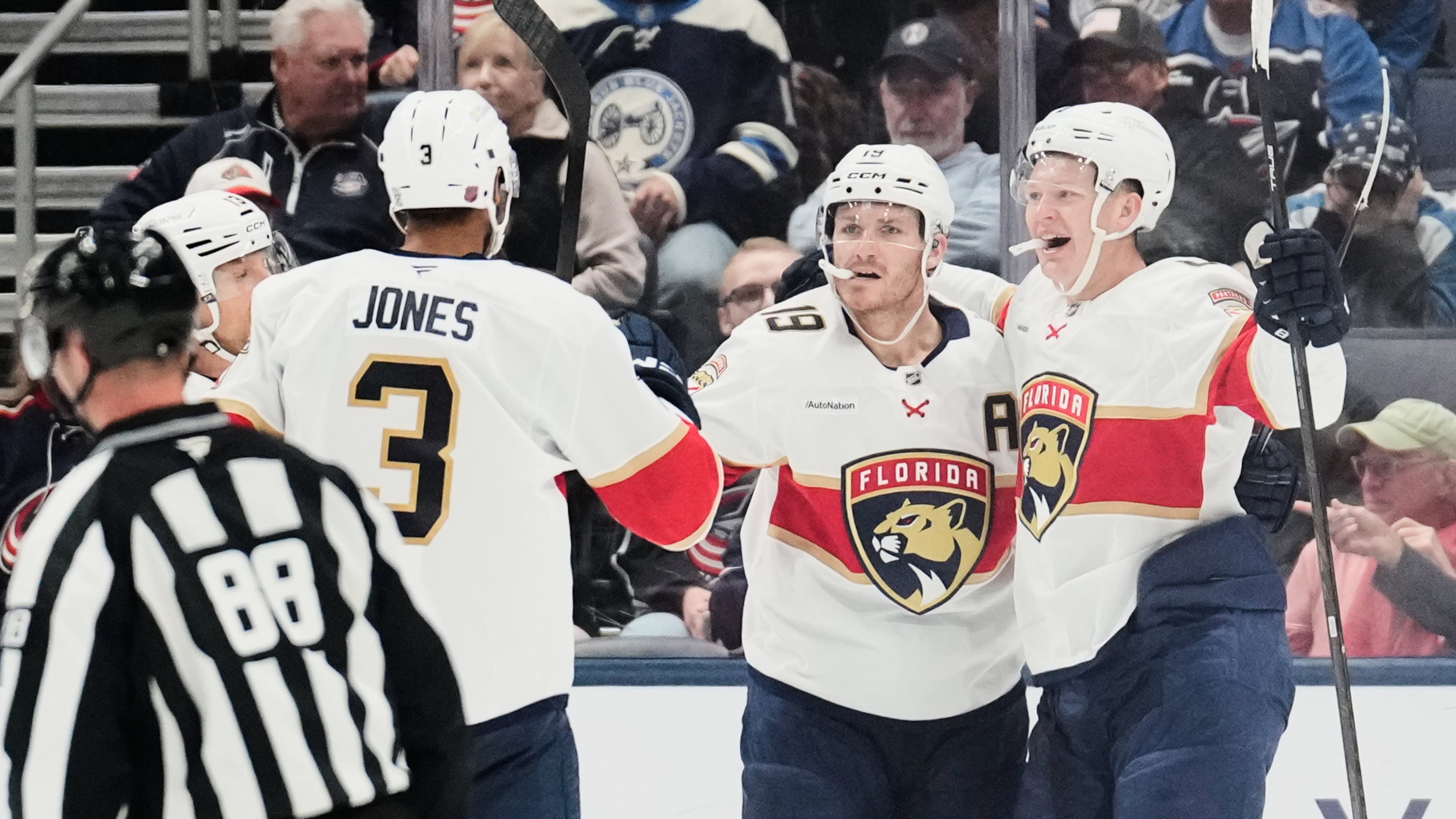Florida Panthers left wing Brady Tkachuk, right, celebrates his goal against the Columbus Blue Jackets with Seth Jones (3) and Matthew Tkachuk (19) in the second period of an NHL hockey game in Columbus, Ohio, Tuesday, Oct. 13, 2026. (AP Photo/Sue Ogrocki)