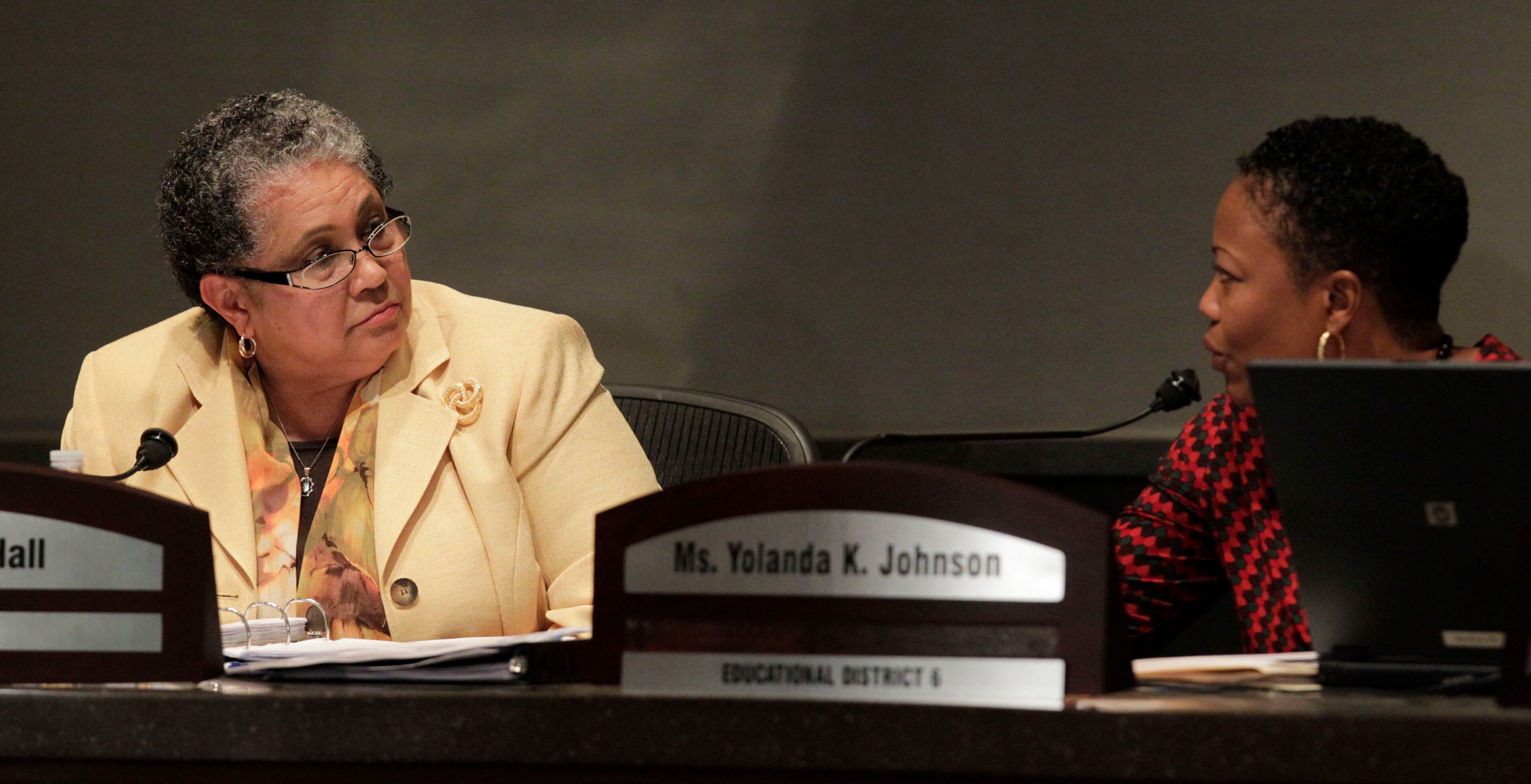 Superintendent Beverly Hall discusses her report on the recommendations of the blue ribbon committee with Yolanda Johnson. She read an extended power point presentation from her binder then answered questions from the board members. At Monday's day long board meeting that began at 2pm, the Atlanta School Board was expected to hear Superintendent Beverly Hall detail what the system will change in the wake of an investigation that found 109 employees may have cheated and 12 city schools have pervasive problems. Meanwhile, the board voted to break into executive session shortly after convening. Bob Andres bandres@ajc.com