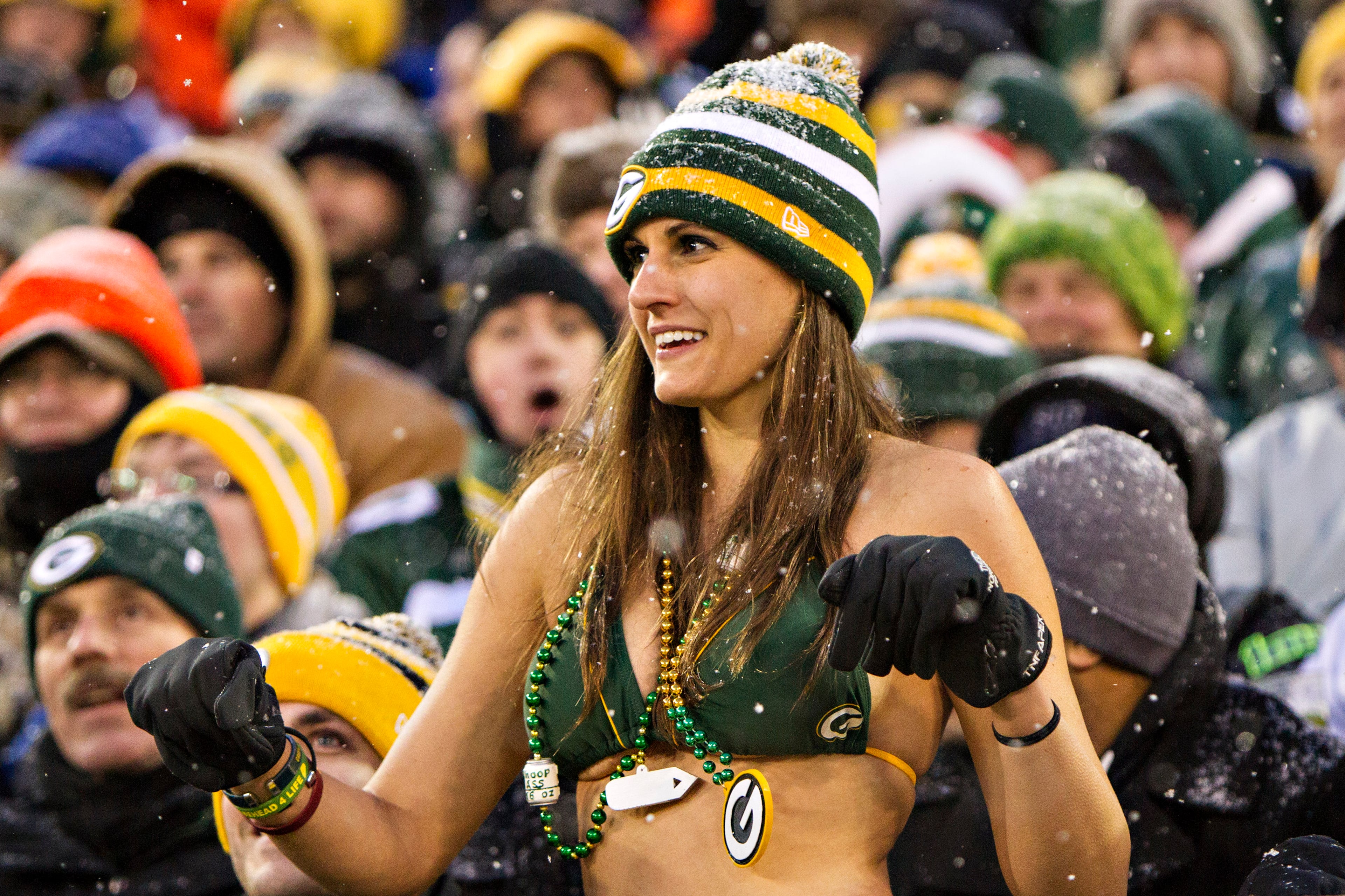 A Green Bay Packers fan dances in the snow in her bathing suit during a game against the Pittsburgh Steelers at Lambeau Field in Green Bay, Wisc. (Photo by Wesley Hitt/Getty Images)