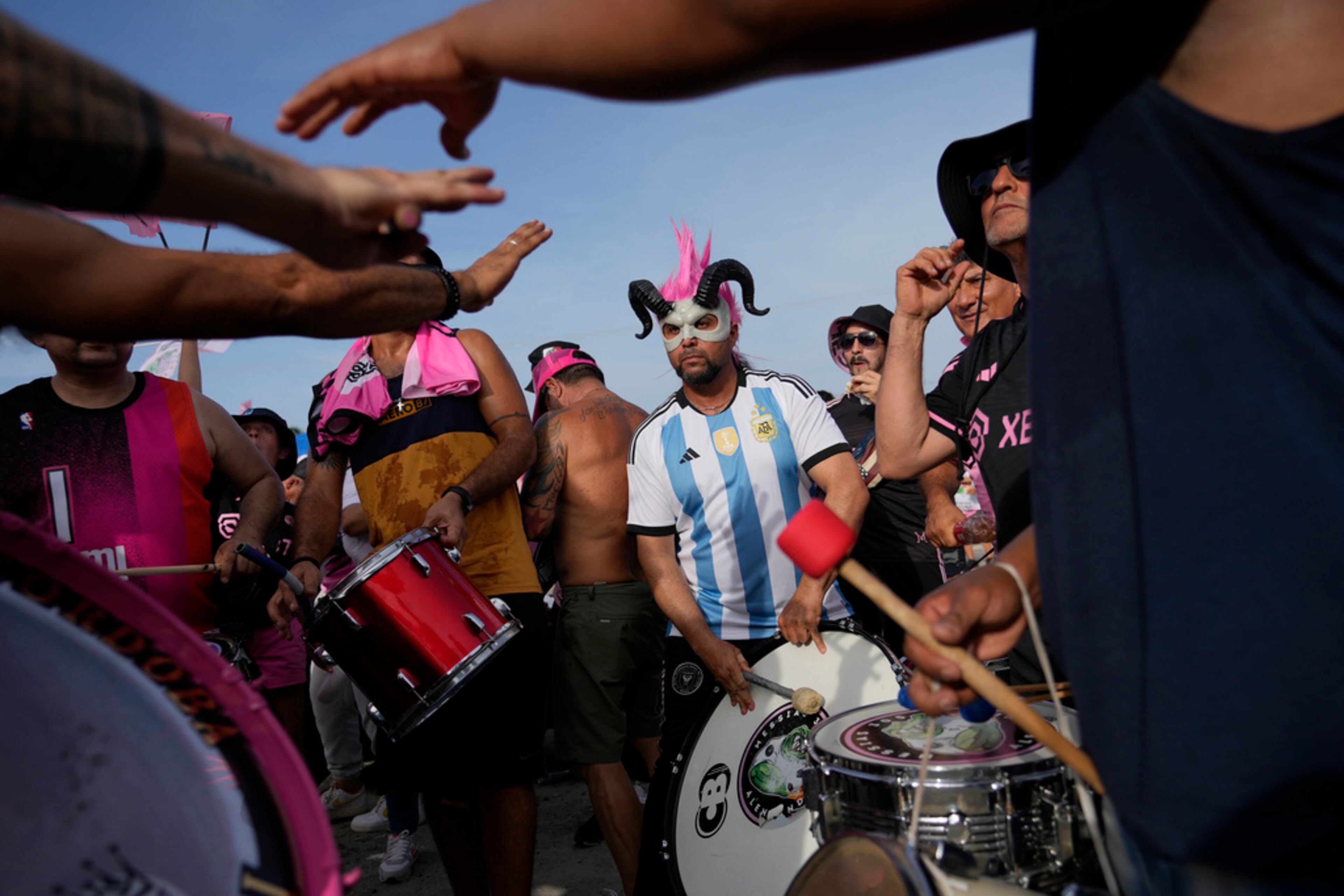 Inter Miami fans listen to a band play before the team's Leagues Cup soccer match against Atlanta United, Tuesday, July 25, 2023, in Fort Lauderdale, Fla. (AP Photo/Rebecca Blackwell)