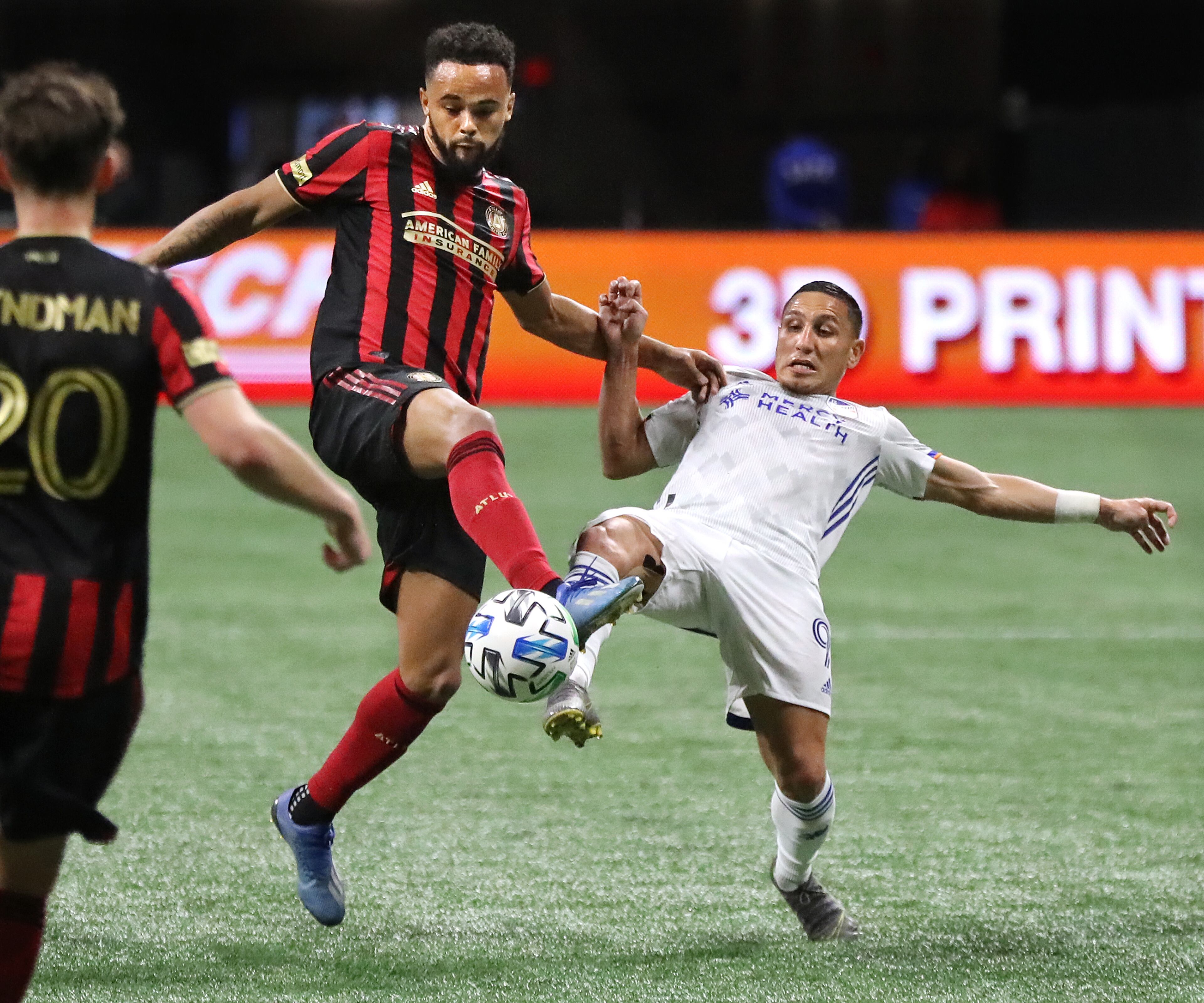 March 8, 2020 Atlanta: Atlanta United defender Anton Walkes (left) just beats FC Cincinnati midfielder Adrien Regattin to the ball during a 2-1 Atlanta United victory in a MLS soccer match on Saturday, March 8, 2020, in Atlanta. Curtis Compton ccompton@ajc.com