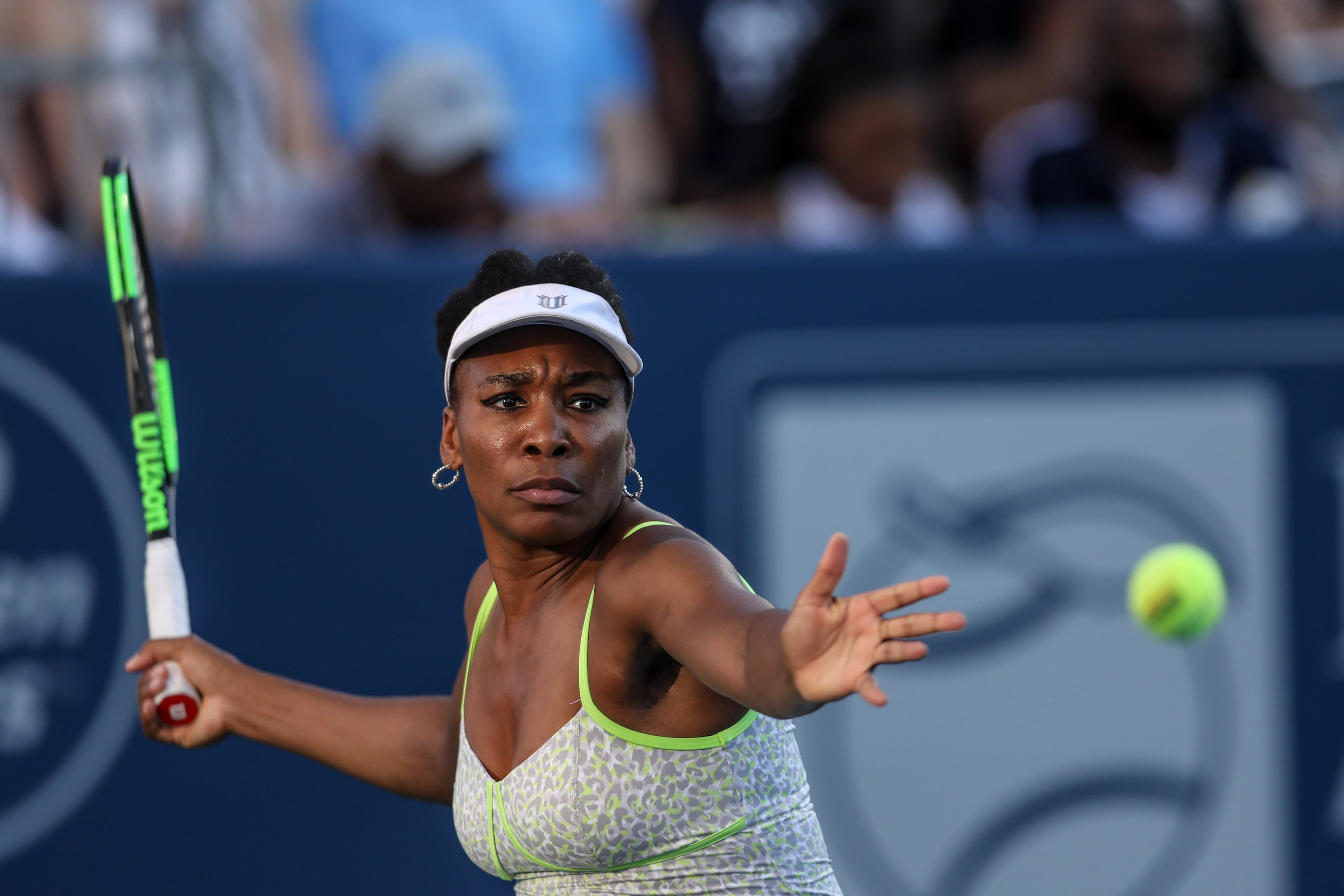 Venus Williams returns a shot to Madison Keys during a special women's exhibition tennis match at the BB&T Atlanta Open Tournament, Sunday, July 21, 2019, in Atlanta. BRANDEN CAMP/SPECIAL