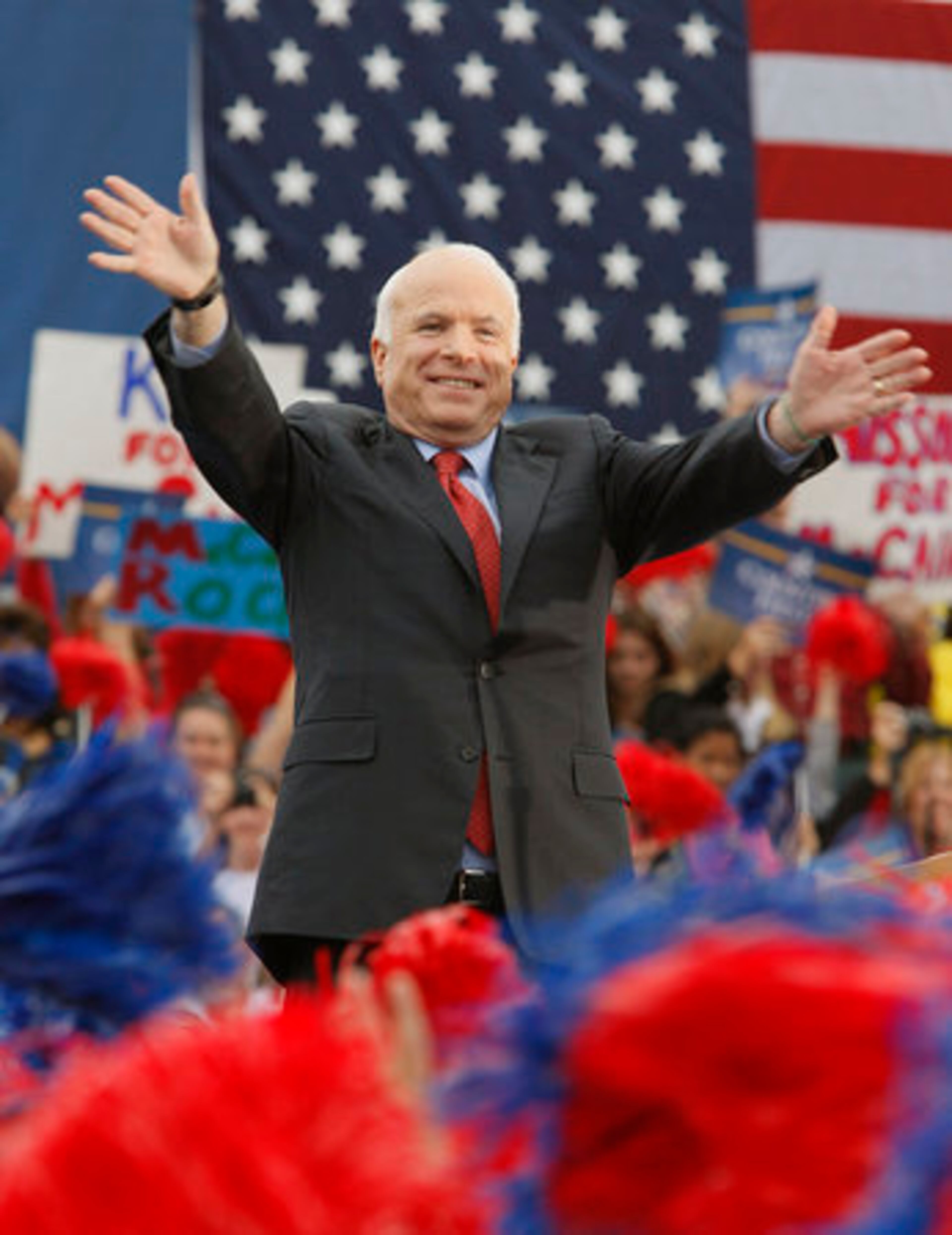 Backed by a large American flag, McCain acknowledges the cheers of his supporters in Belton, Mo. as the senior U.S. Senator from Arizona eyes the White House. "My country has never had to prove anything to me. I have always had faith in it," McCain said during an Ohio rally in October 2008. "If I'm elected President, I will fight to shake up Washington and take America in a new direction from my first day in office until my last. I'm not afraid of the fight, I'm ready for it."
