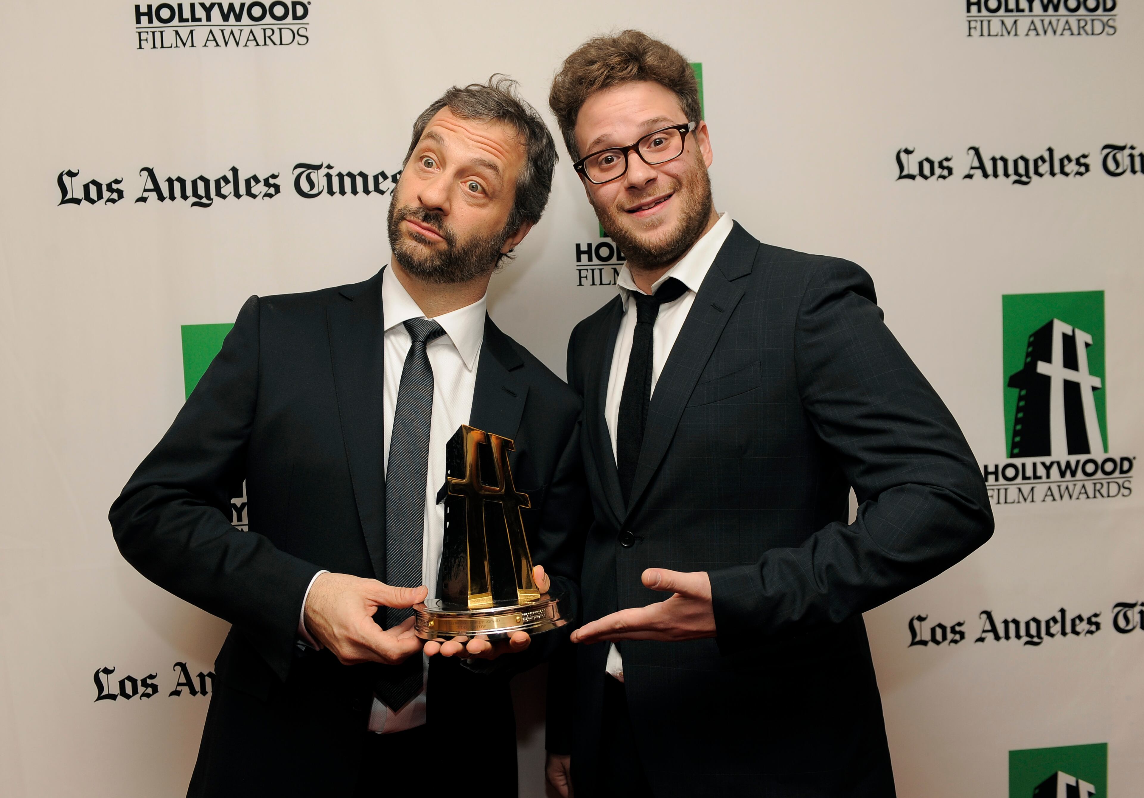 Judd Apatow, left, recipient of the Hollywood Comedy Award, poses with actor Seth Rogen backstage at the 16th Annual Hollywood Film Awards Gala on Monday, Oct. 22, 2012, in Beverly Hills, Calif.
