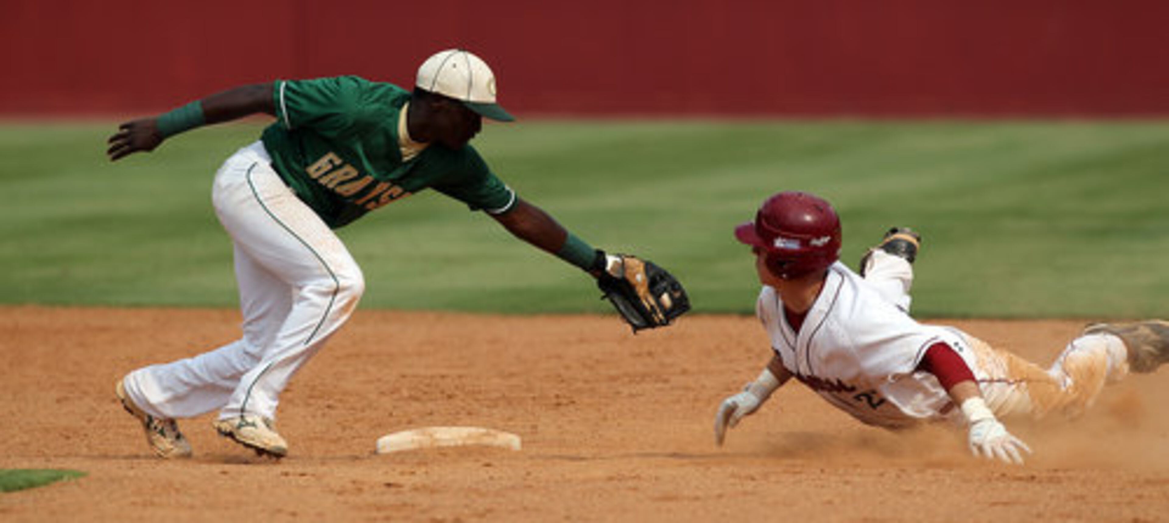 Brookwood's Michael Gouge avoids the tag from Grayson second baseman Jeril Dawson sliding in wide for a double during 4th inning action in game one of a double header at Brookwood High School in Snellville on Monday, May 21, 2012. Brookwood won game one 10-0 in five innings.