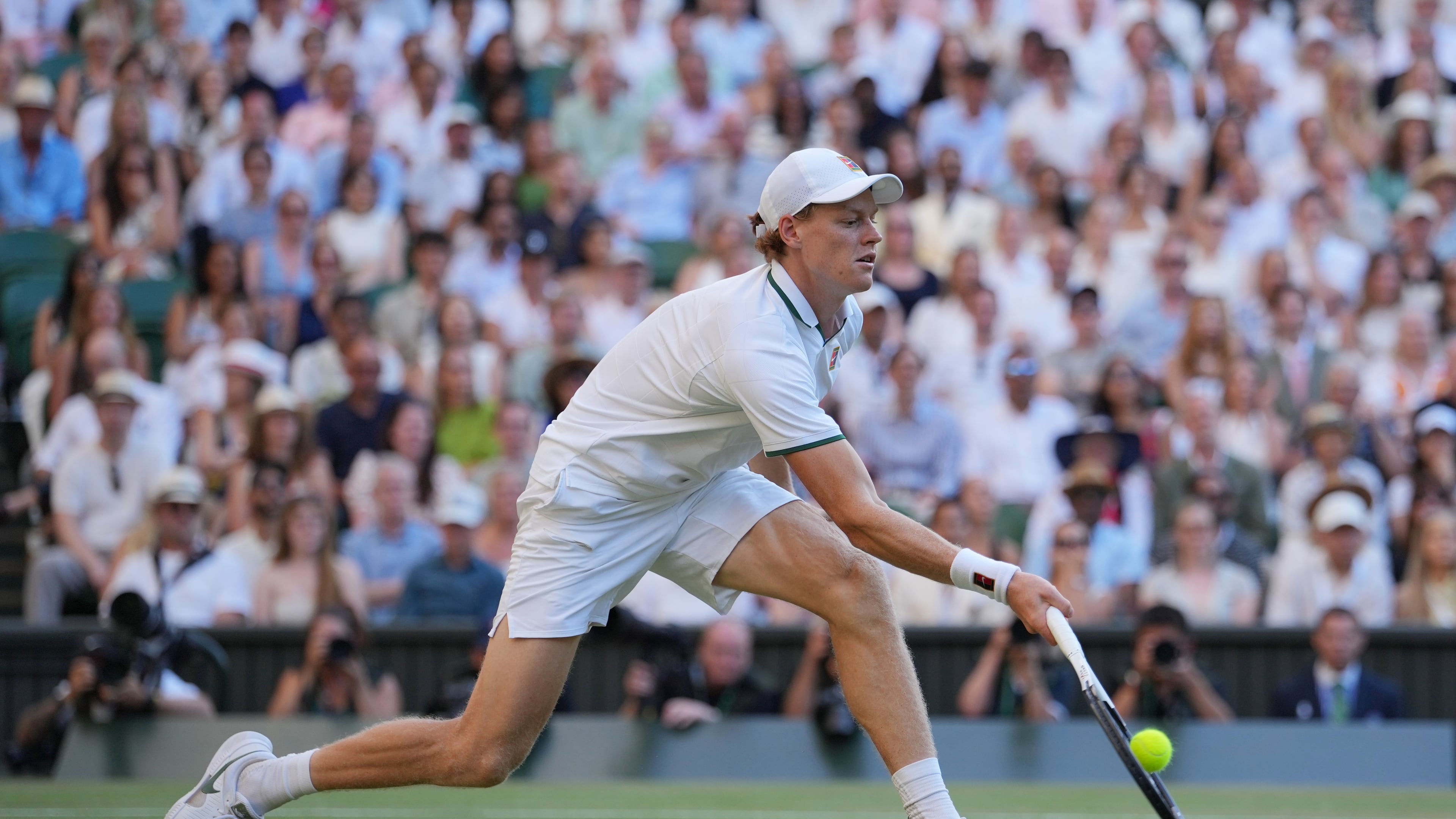 Jannik Sinner of Italy plays a return to Alexander Zverev of Germany during the men's singles final at Wimbledon Tennis Championships in London, Sunday, July 12, 2026. (AP Photo/Kin Cheung)