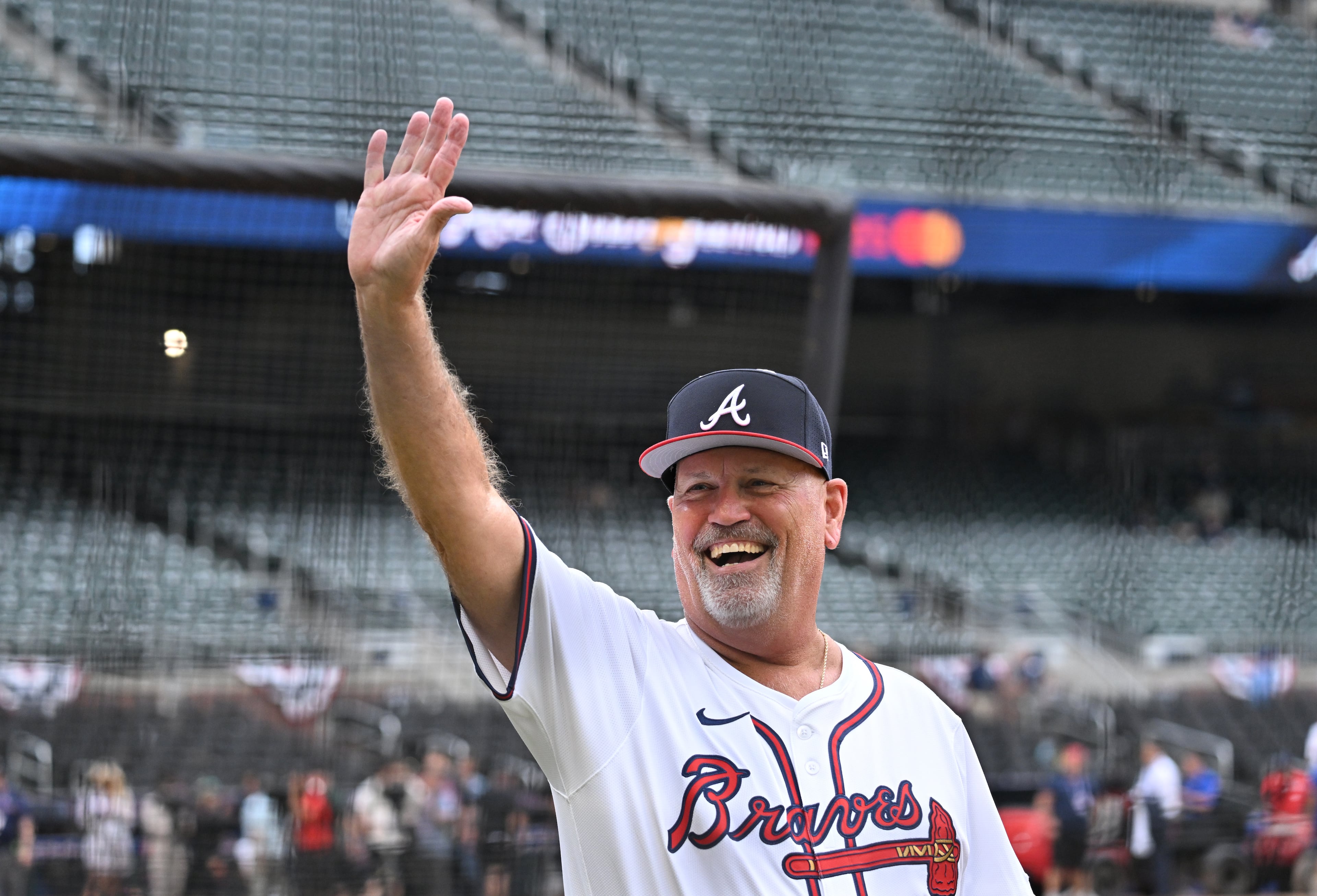 Atlanta Braves manager Brian Snitker waves as he walks onto the baseball field before the 2025 MLB All-Star Game at Truist Park, Tuesday, July 15, 2025, in Atlanta. (Hyosub Shin/AJC)
