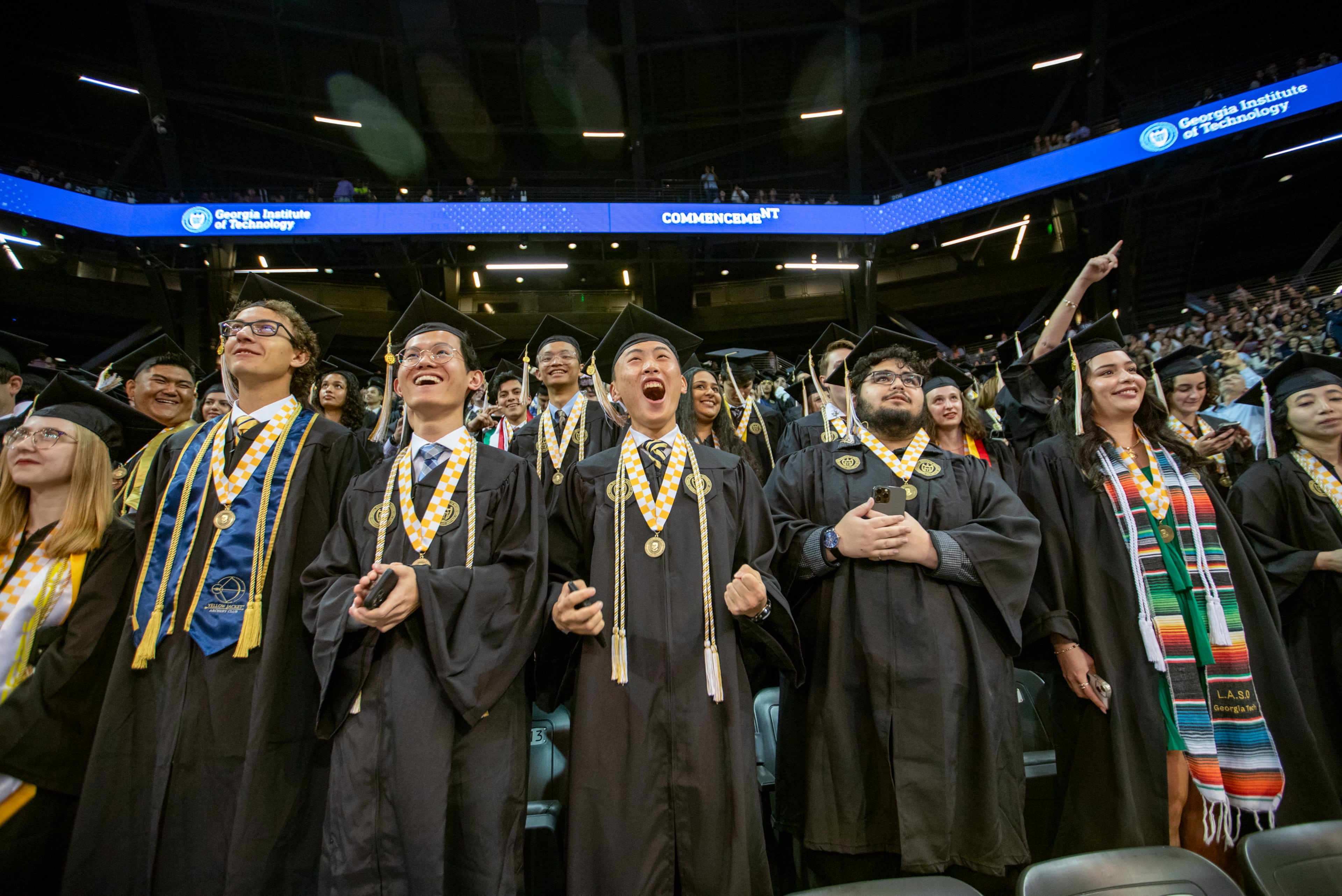 Marvin Ren, center, celebrates his graduation from Georgia Tech at McCamish Pavilion on Saturday, May 4, 2024 with he fellow mechanical engineering classmates. (Jenni Girtman for The Atlanta Journal-Constitution)