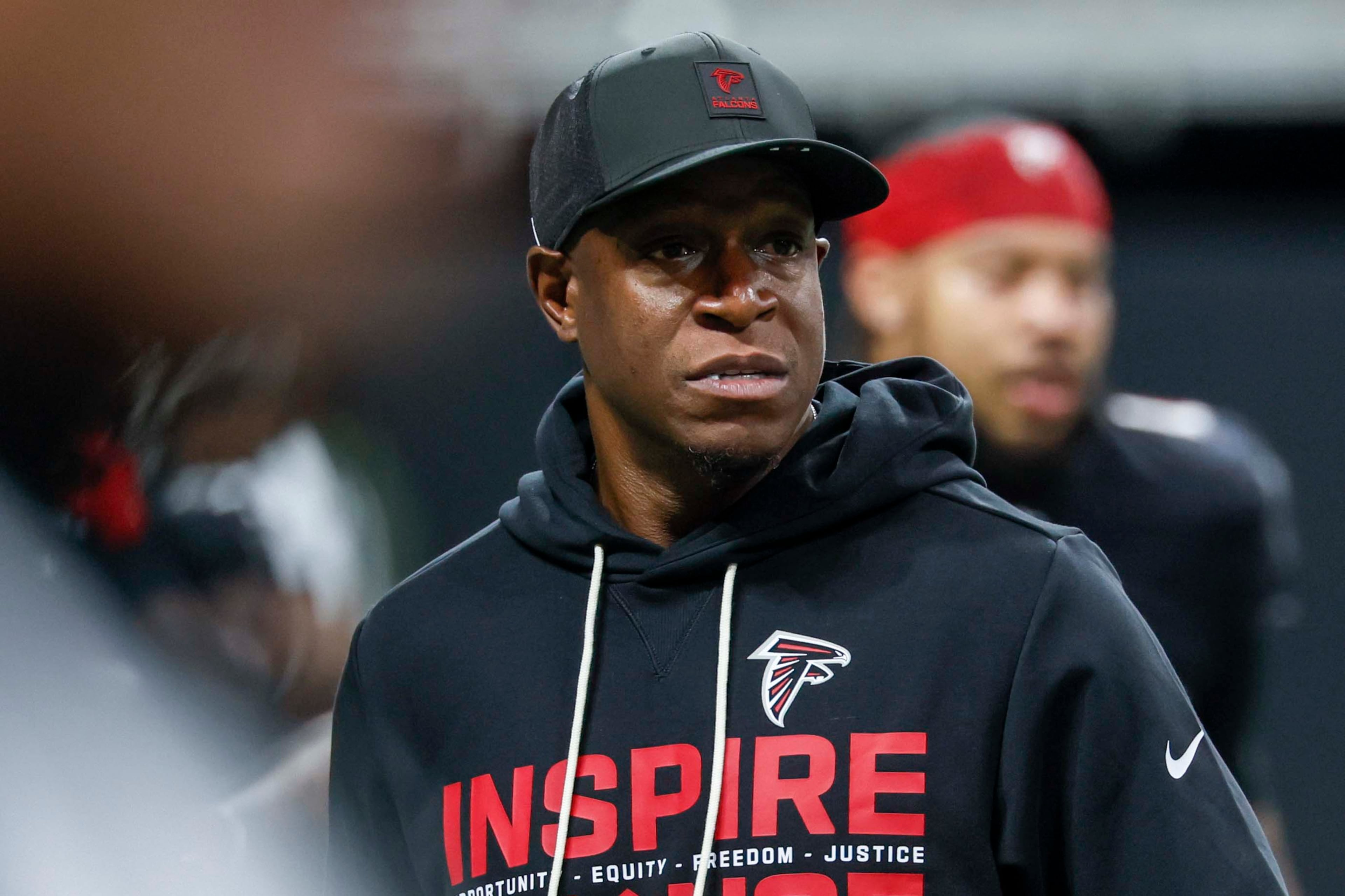 Then-Falcons coach Raheem Morris looks on during warmups ahead of his team’s matchup with the New Orleans Saints on Sunday, Jan. 4, 2026, at Mercedes-Benz Stadium in Atlanta. (Miguel Martinez/AJC)