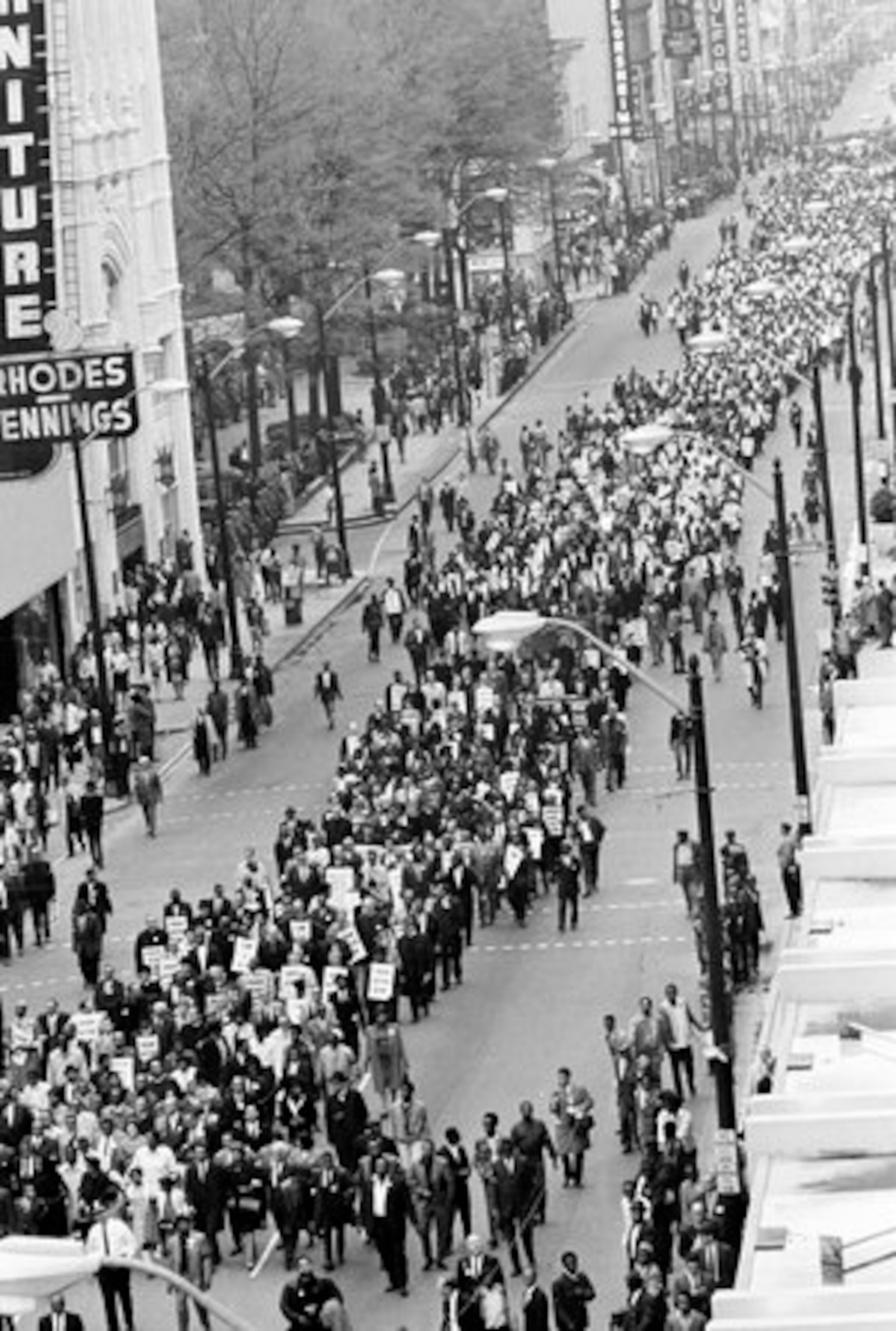 Coretta Scott King, widow of slain civil rights leader Dr. Martin Luther King, Jr., and her children, lower left, lead a march in Memphis, Tenn., in Dr. King's honor, April 8, 1968. King, who had been in Memphis to lead this march in sympathy of striking sanitation workers, was assassinated last Thursday. They are shown marching down Main Street in Memphis. (AP Photo)