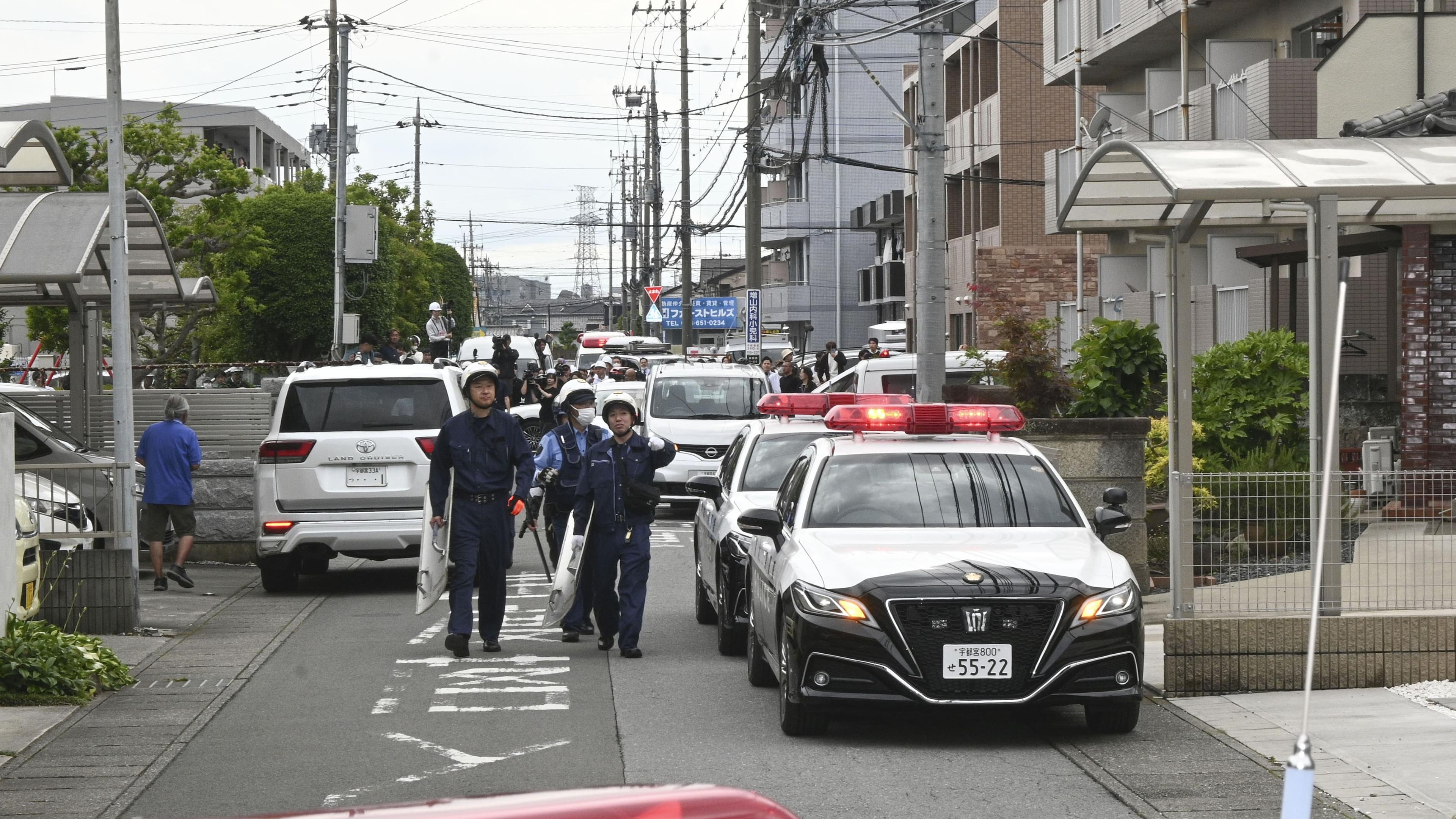 Police are seen at a residential area where a bare showed up in Utsunomiya, north of Tokyo Tuesday, June 9, 2026. (Kyodo News via AP)