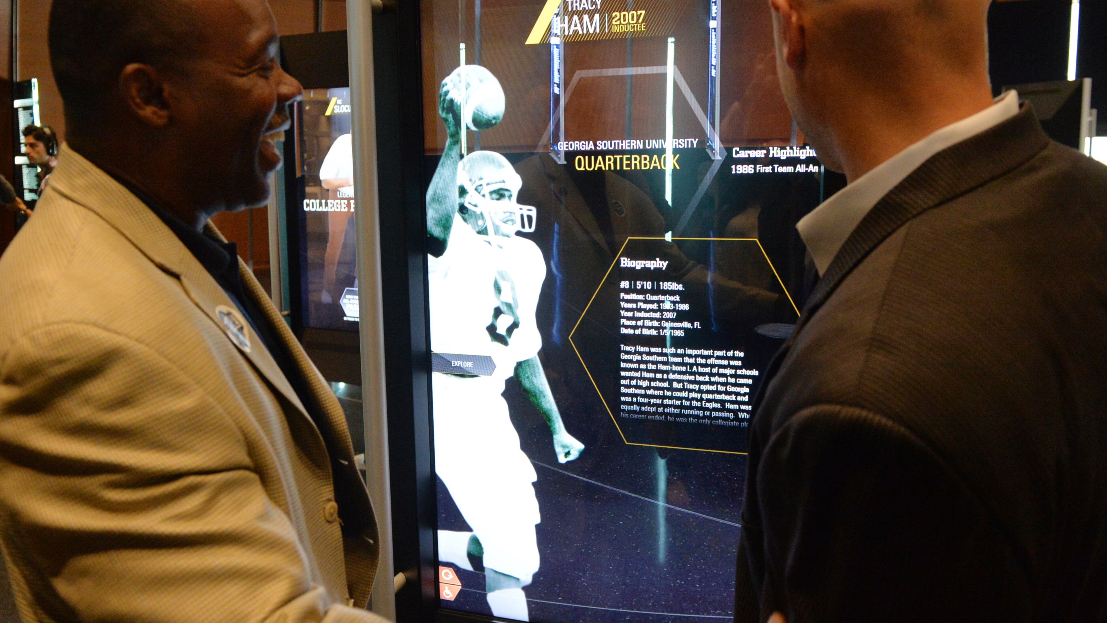 In the actual Hall of Fame, the names of Hall of Famers are etched into glass. Gone are the plaques from South Bend, replaced by 55-inch touchscreens on swivels. KENT D. JOHNSON / KDJOHNSON@AJC.COM