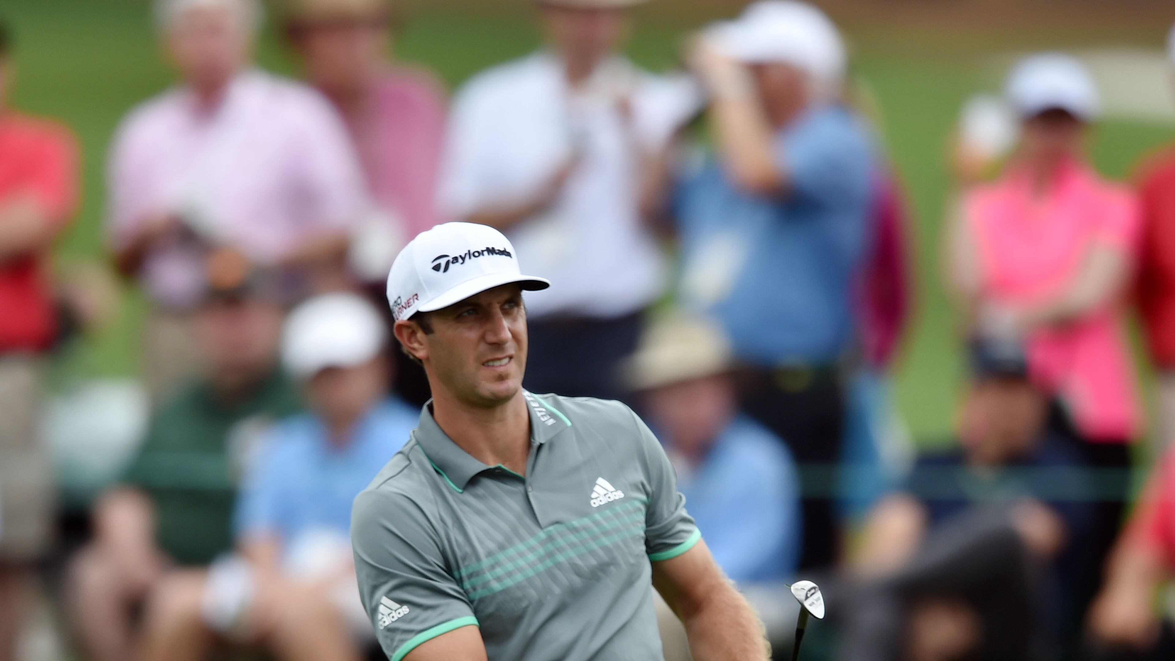 Dustin Johnson chips onto the #2 green. Photos from the final round at the Masters Golf Tournament, Sunday, April 12, 2015. BRANT SANDERLIN/BSANDERLIN@AJC.COM