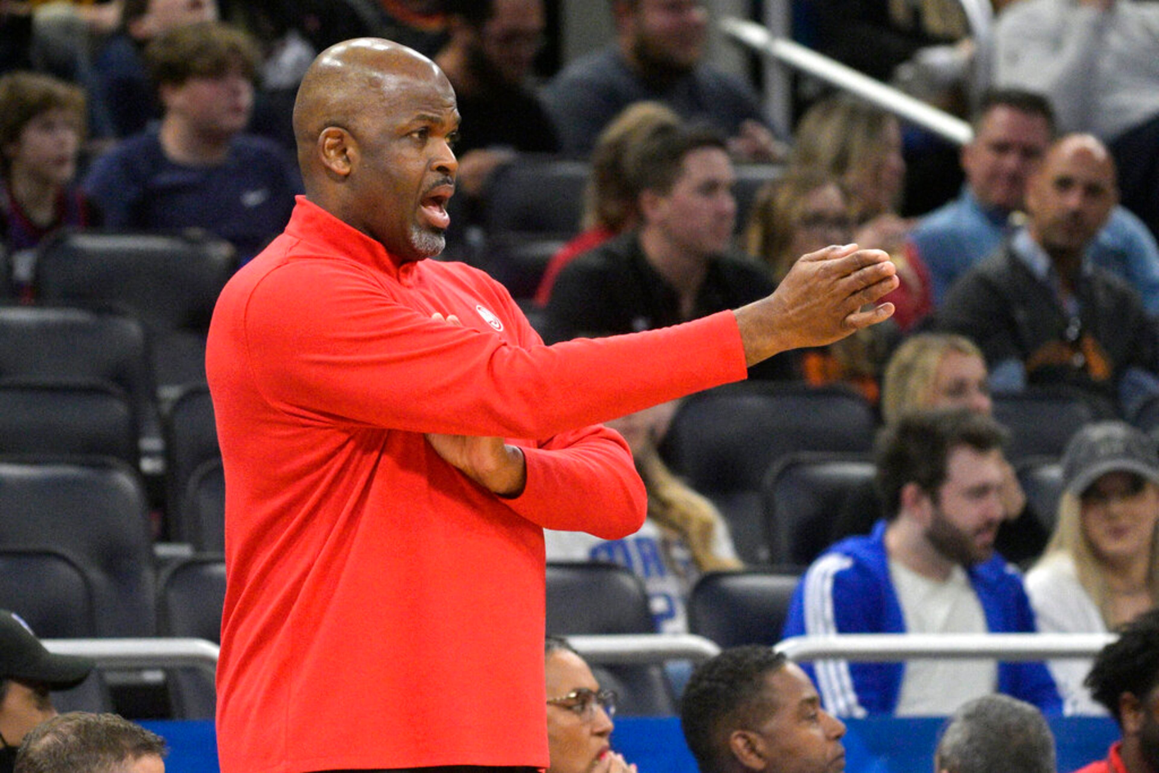 Atlanta Hawks coach Nate McMillan calls out instructions during the first half of the team's NBA basketball game against the Orlando Magic, Wednesday, Feb. 16, 2022, in Orlando, Fla. (AP Photo/Phelan M. Ebenhack)