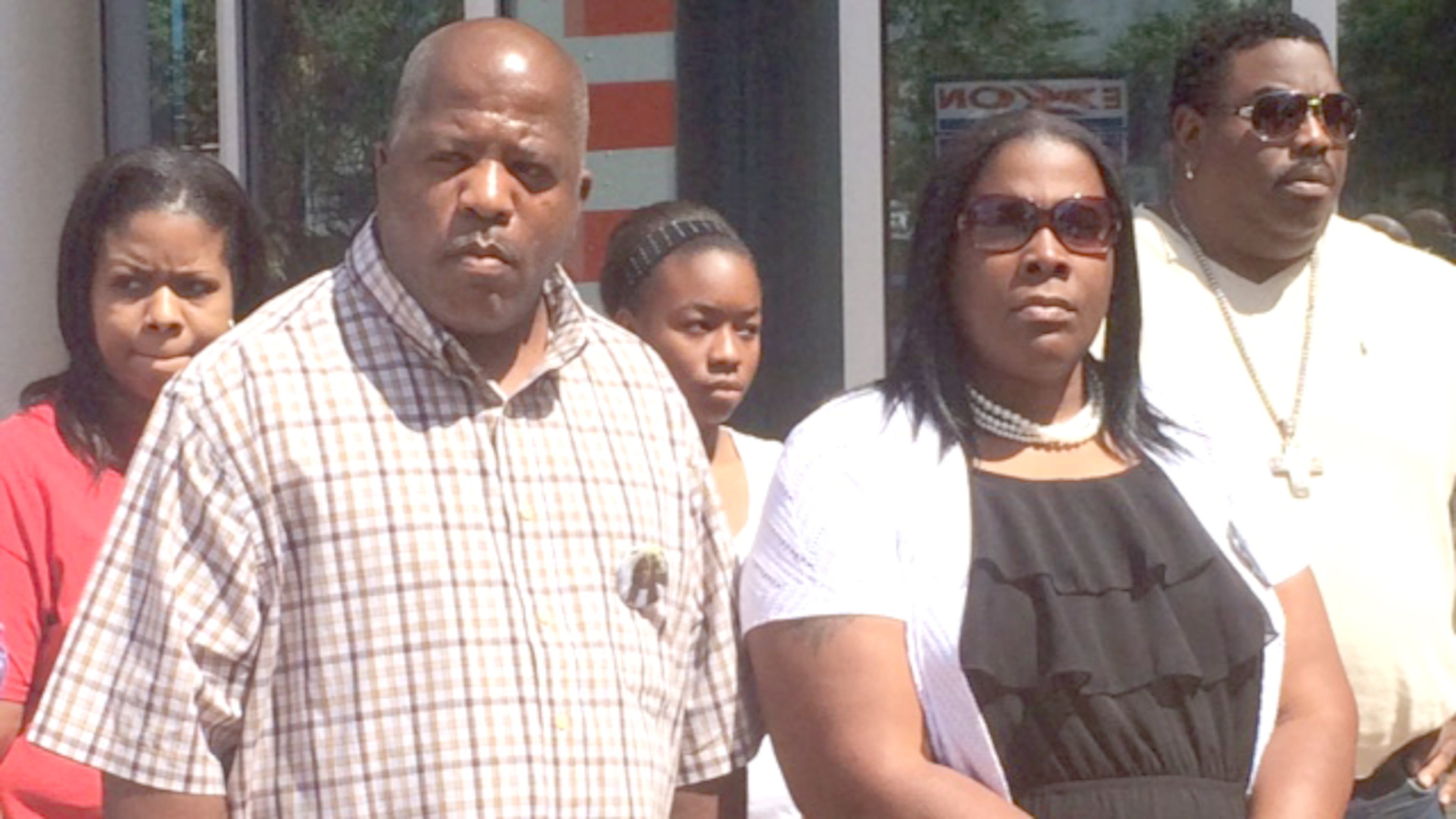 Kenneth and Jackie Johnson, front, after speaking with federal prosecutors on Monday in Macon. Christian Boone / cboone@ajc.com