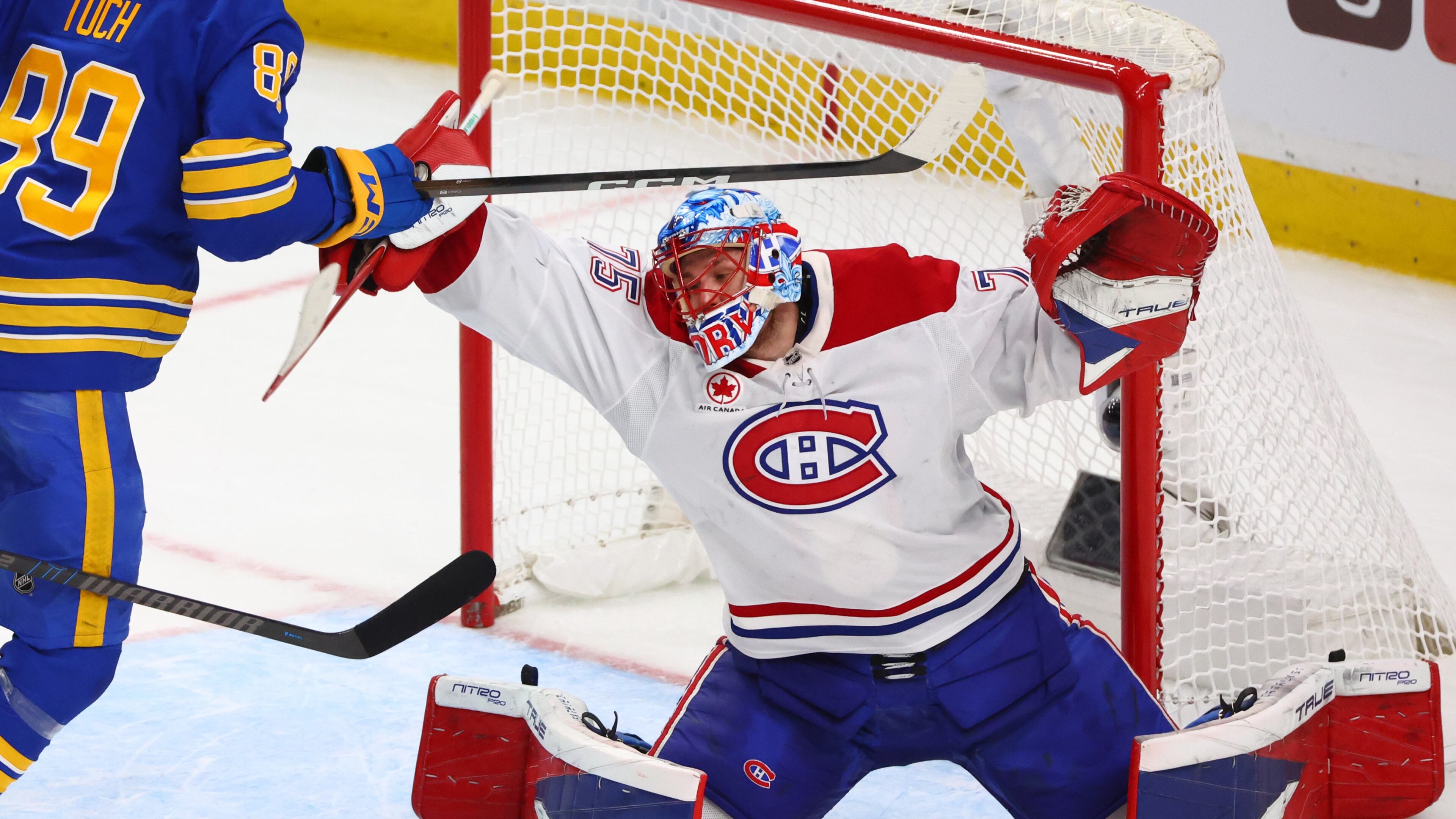 Montreal Canadiens goaltender Jakub Dobes makes a save during the third period in Game 5 of a second-round NHL hockey Stanley Cup playoff series against the Buffalo Sabres, Thursday, May 14, 2026, in Buffalo, N.Y. (AP Photo/Jeffrey T. Barnes)