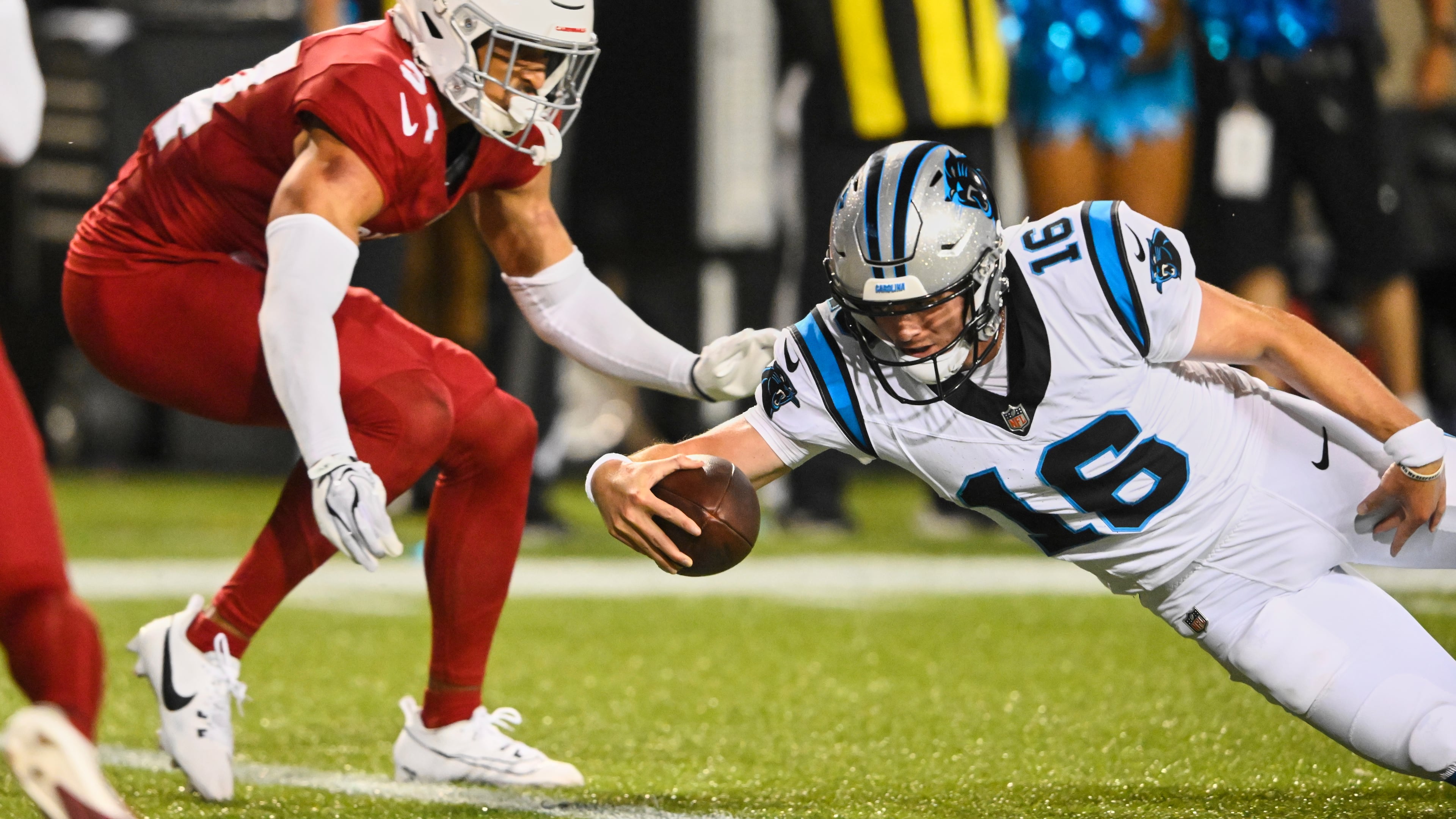 Carolina Panthers quarterback Haynes King (16) dives into the endzone next to Arizona Cardinals safety Isaiah Oliver, left, to win the game on the last play of the game in the second half of the Pro Football Hall of Fame NFL preseason game in Canton, Ohio, Thursday, Aug. 6, 2026. (AP Photo/David Richard)