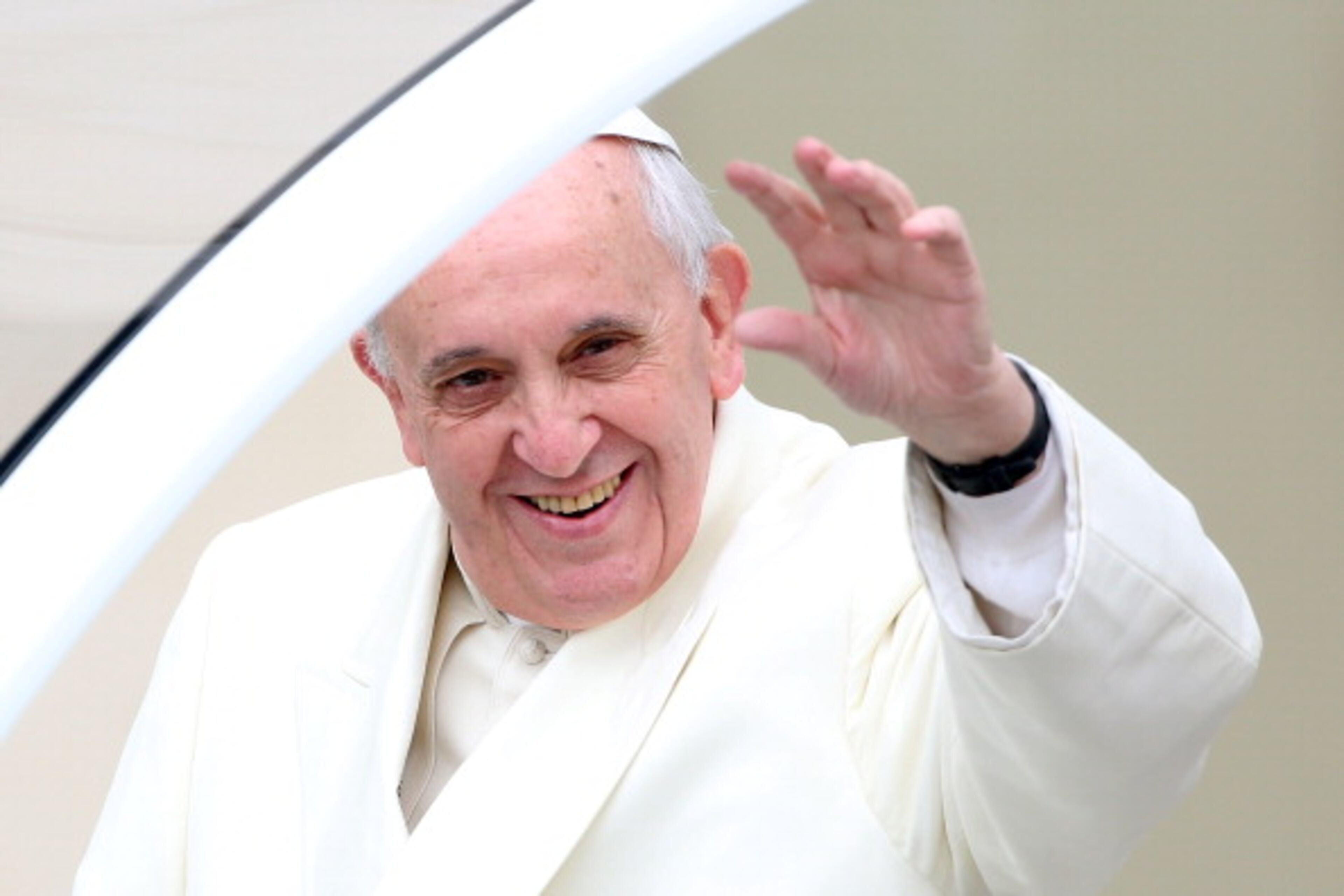 VATICAN CITY, VATICAN - JANUARY 22: Pope Francis waves to the crowds as he arrives in St. Peter's square for his weekly audience on January 22, 2014 in Vatican City, Vatican. Pope Francis devoted the catechetical portion of his weekly General Audience to the Week of Prayer for Christian Unity. The main reflection delivered by Pope Francis in Italian, said, 'We know that Christ has not been divided; yet we must sincerely recognize that our communities continue to experience divisions which are a source of scandal and weaken our witness to the Gospel.' (Photo by Franco Origlia/Getty Images)