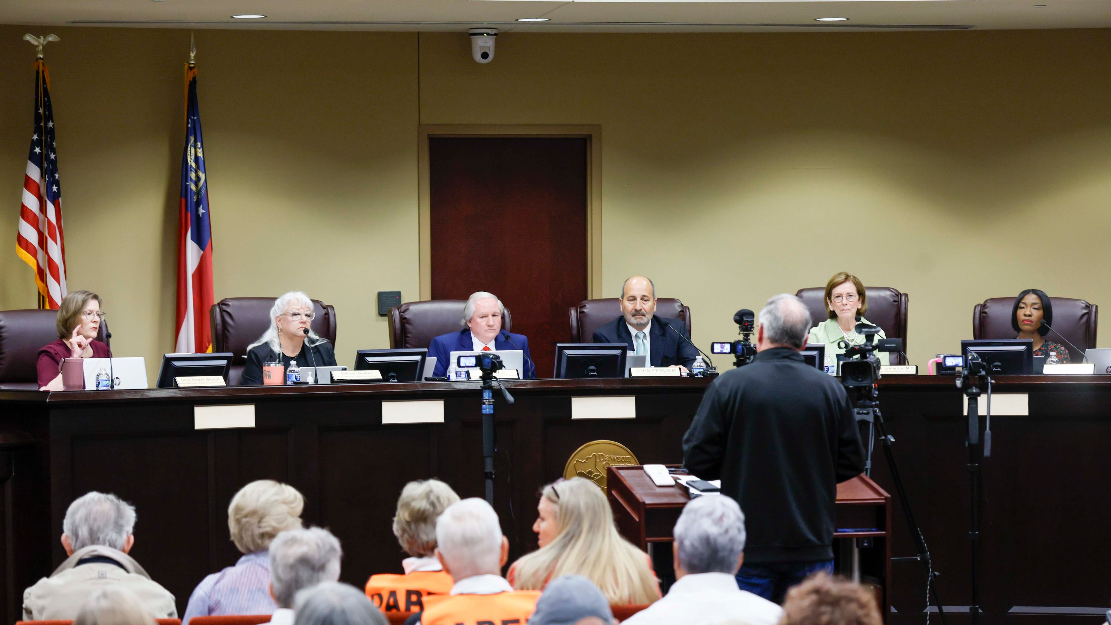 Board members listen to a speaker during a State Election Board meeting at Dawson County Government Center on Wednesday, April 15, 2026. (Miguel Martinez/AJC)