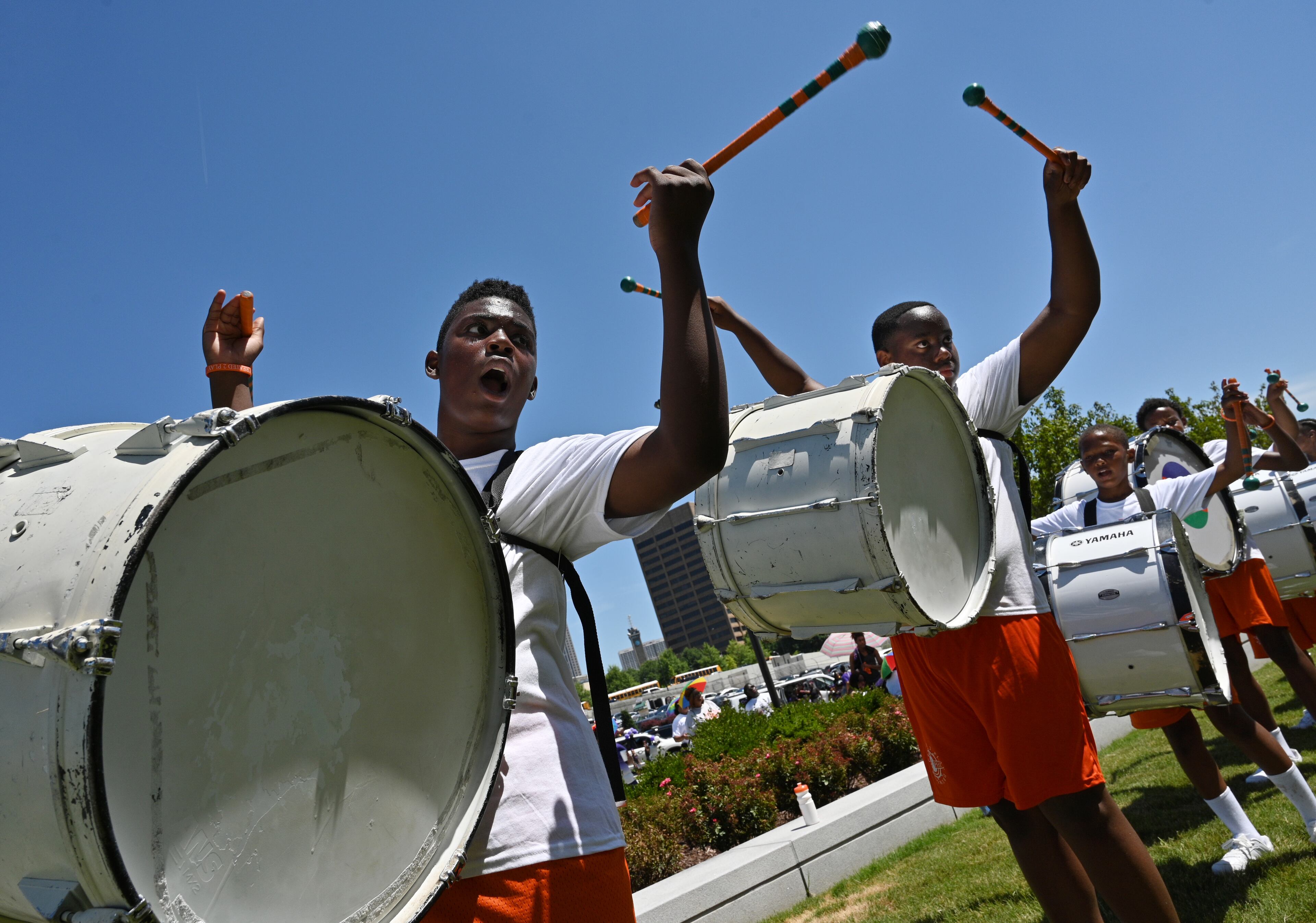 Members of Created To Play Drumline practice near the Liberty plaza before the start of the Juneteenth Atlanta Black History Parade on Saturday, June 18, 2022. (Hyosub Shin / Hyosub.Shin@ajc.com)