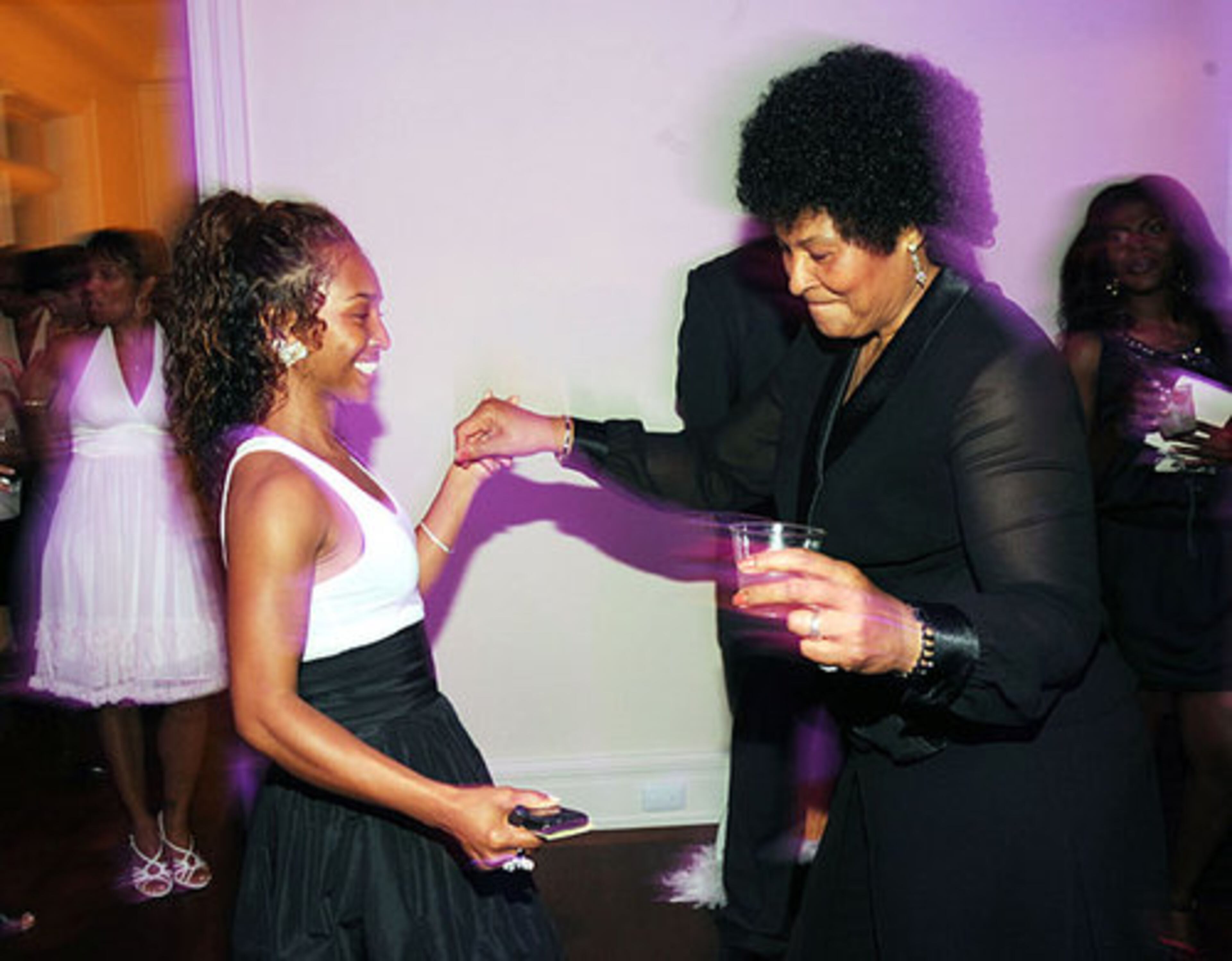 Chilli chats with Dallas Austin's Aunt Claire at the Dallas Austin Foundation's Black Carpet premiere.