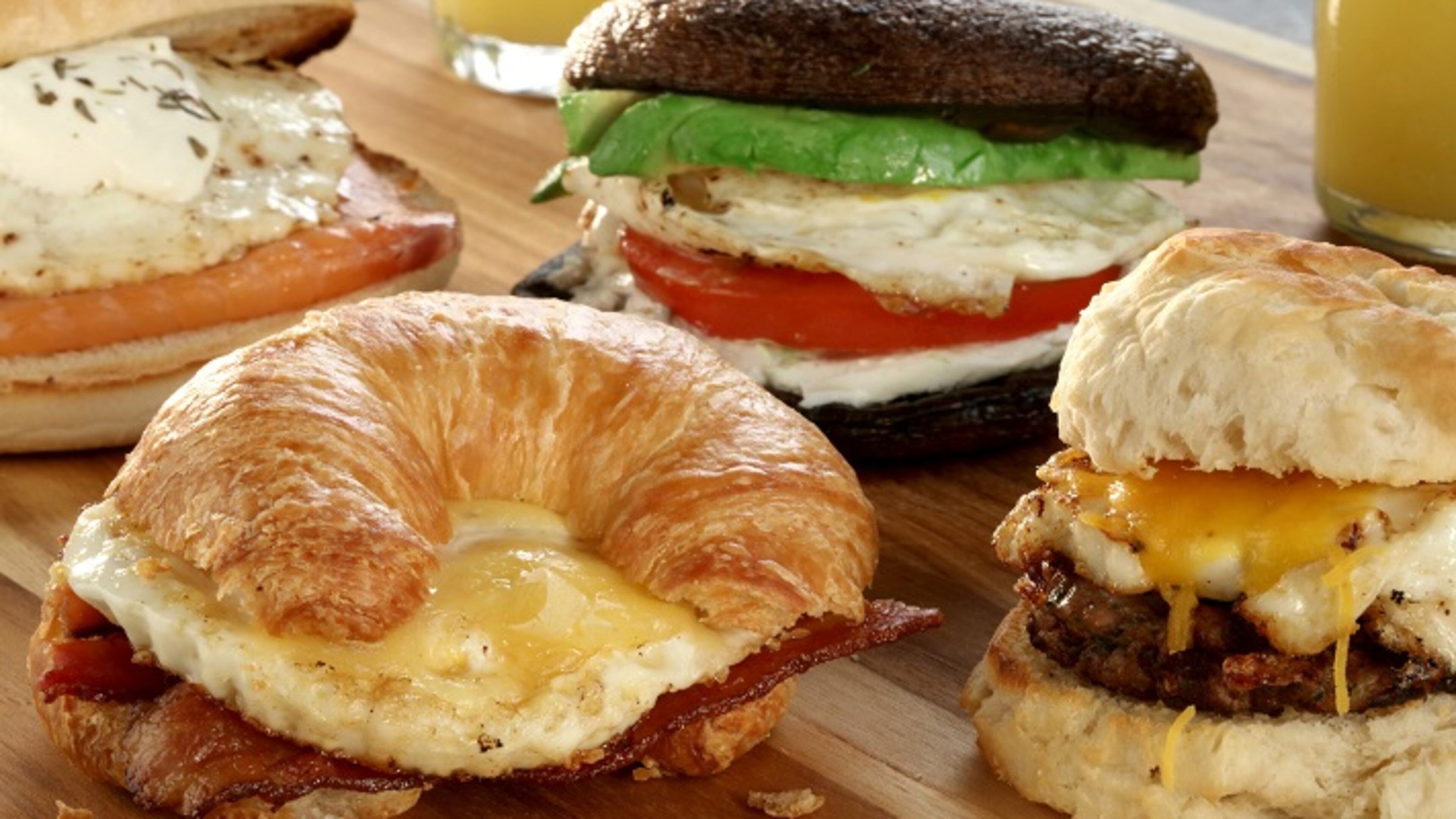 Choose your favorite components and build: smoked salmon and egg on English muffin, from left, bacon and egg on croissant, avocado, tomato and egg on sauteed portobello mushroom caps (for a paleo approach) and sausage and egg on a biscuit. (Michael Tercha/Chicago Tribune/TNS)