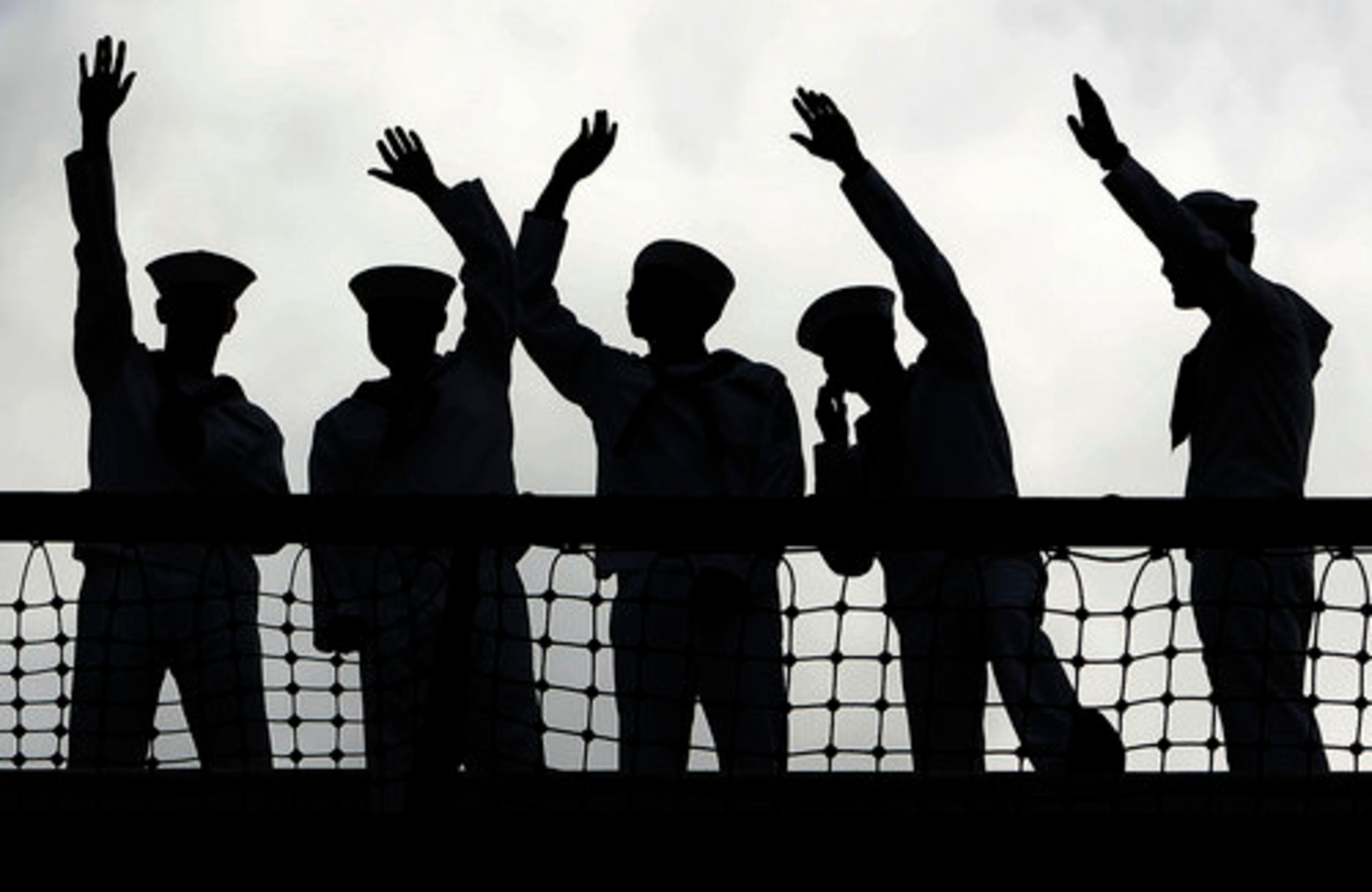 The Kitty Hawk, with sailors lining its decks, pulled away from Yokosuka port just south of Tokyo to the cheers of hundreds of schoolchildren and the sounds of brass bands.