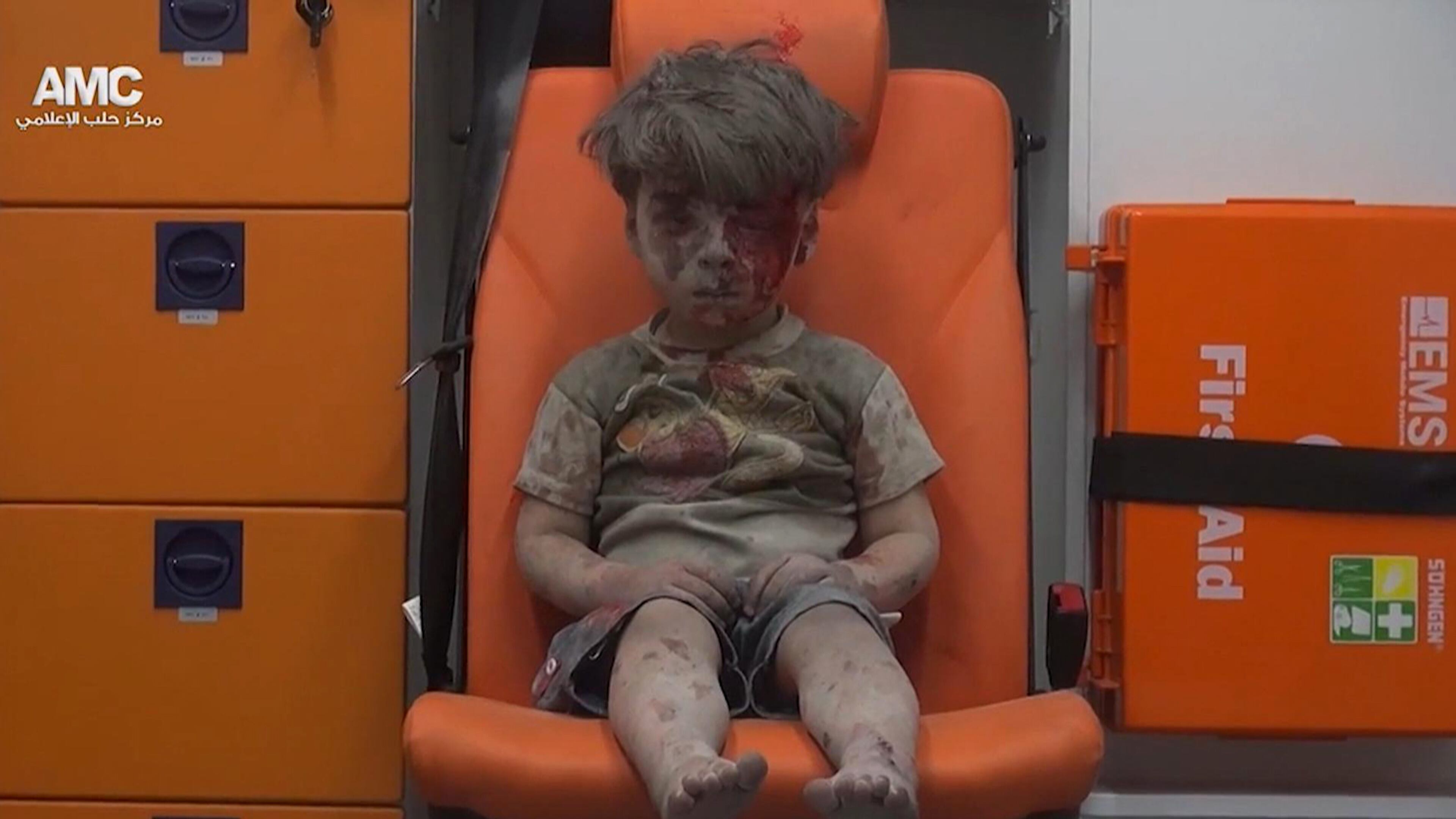 FILE - In this frame grab taken from video provided by the Syrian anti-government activist group Aleppo Media Center (AMC), 5-year-old Omran Daqneesh sits in an ambulance after being pulled out or a building hit by an airstirke, in Aleppo, Syria, Wednesday, Aug. 17, 2016. The White Helmets, were among the crowd of first responders who pulled Daqneesh and his family from the rubble of their apartment building Wednesday night. (Aleppo Media Center via AP)