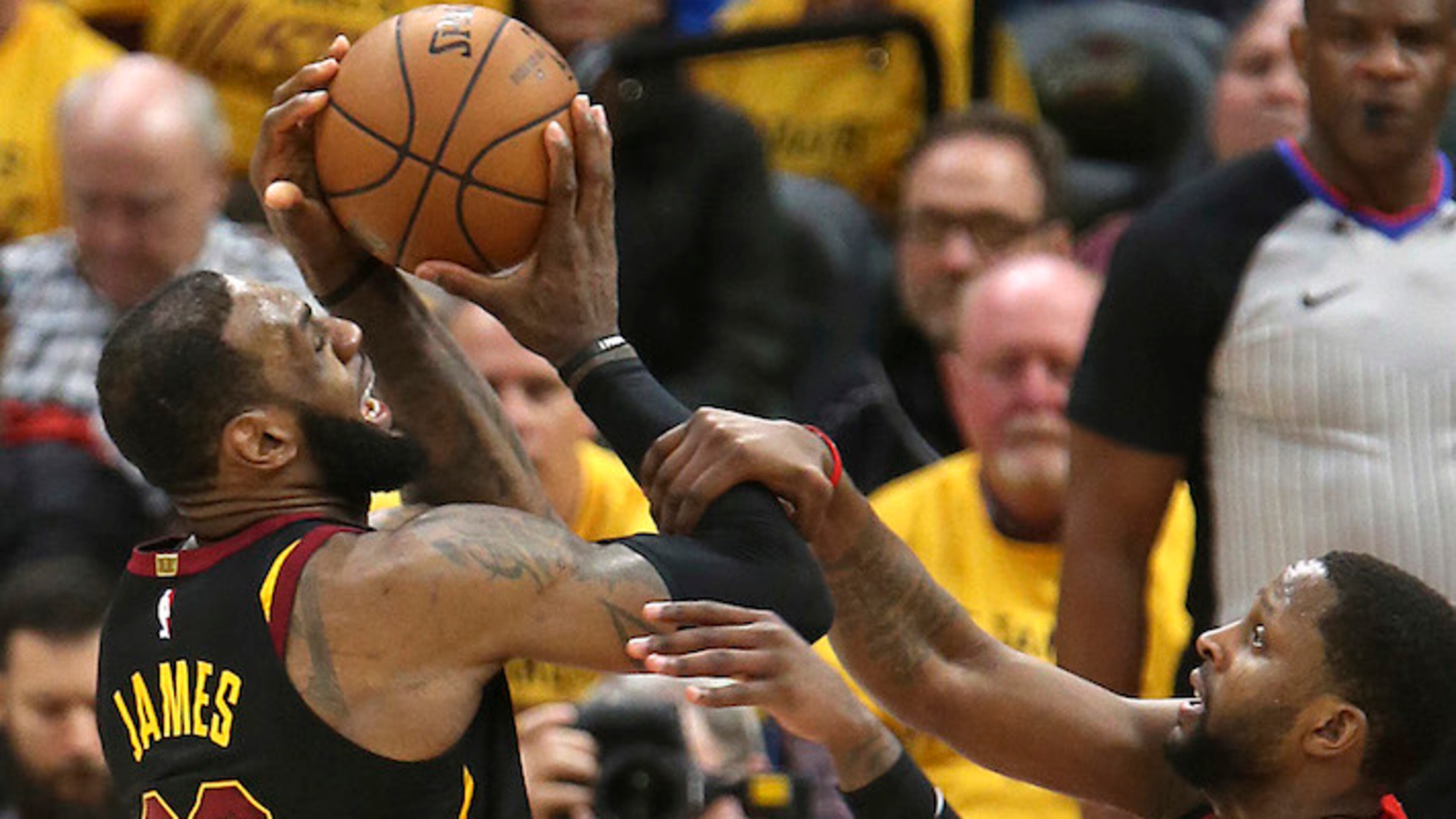 Cleveland Cavaliers' LeBron James is fouled by Toronto Raptors' C.J. Miles in the third quarter of Game 4 of a second-round playoff series on Monday, May 7, 2018 in Cleveland, Ohio. The Cavaliers won the game 128-93 to sweep the series against the Raptors. (Phil Masturzo/Akron Beacon Journal/TNS)