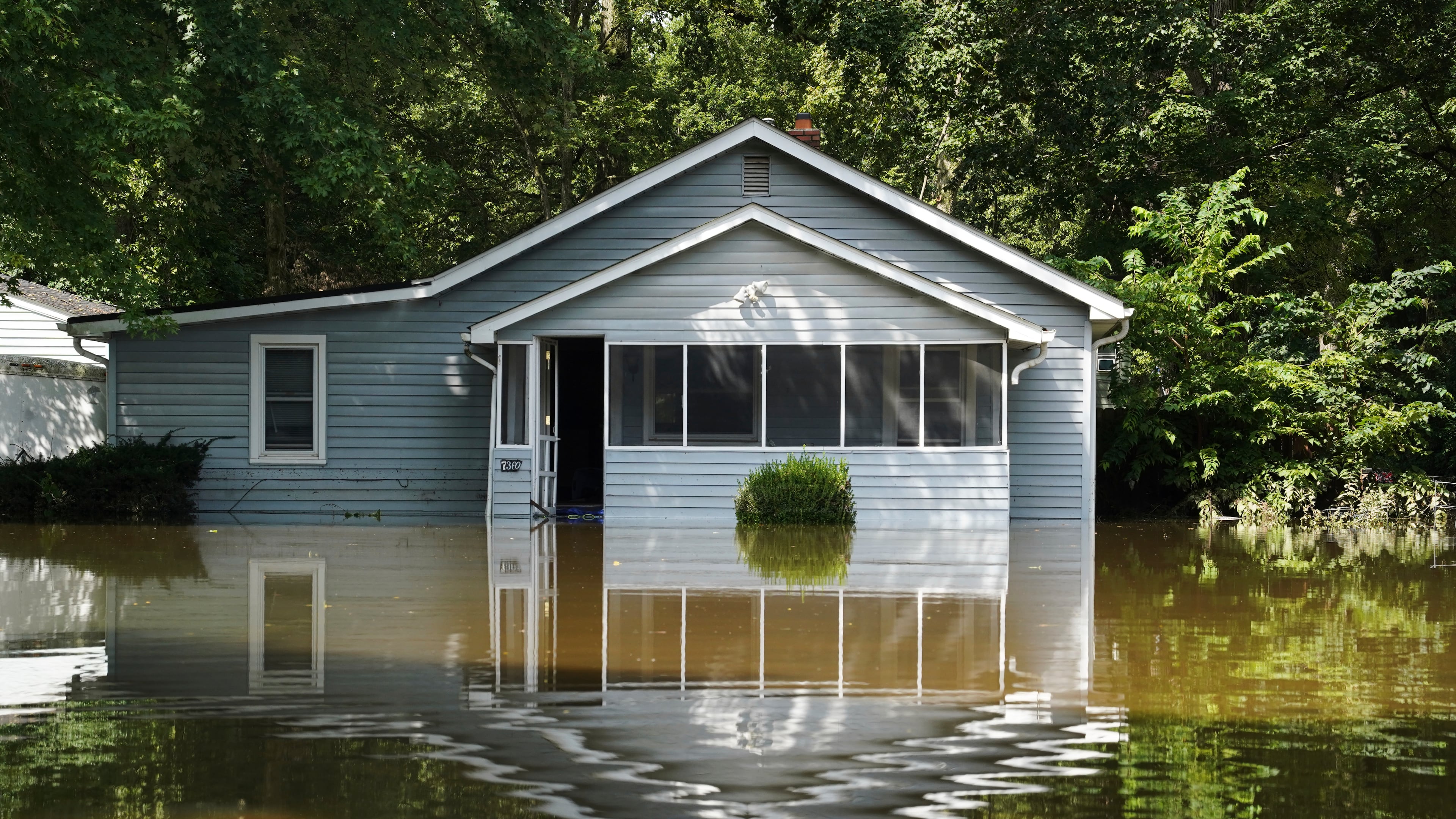 A flooded home is seen in Indianapolis, Sunday, Aug. 16, 2026. (AP Photo/Obed Lamy)