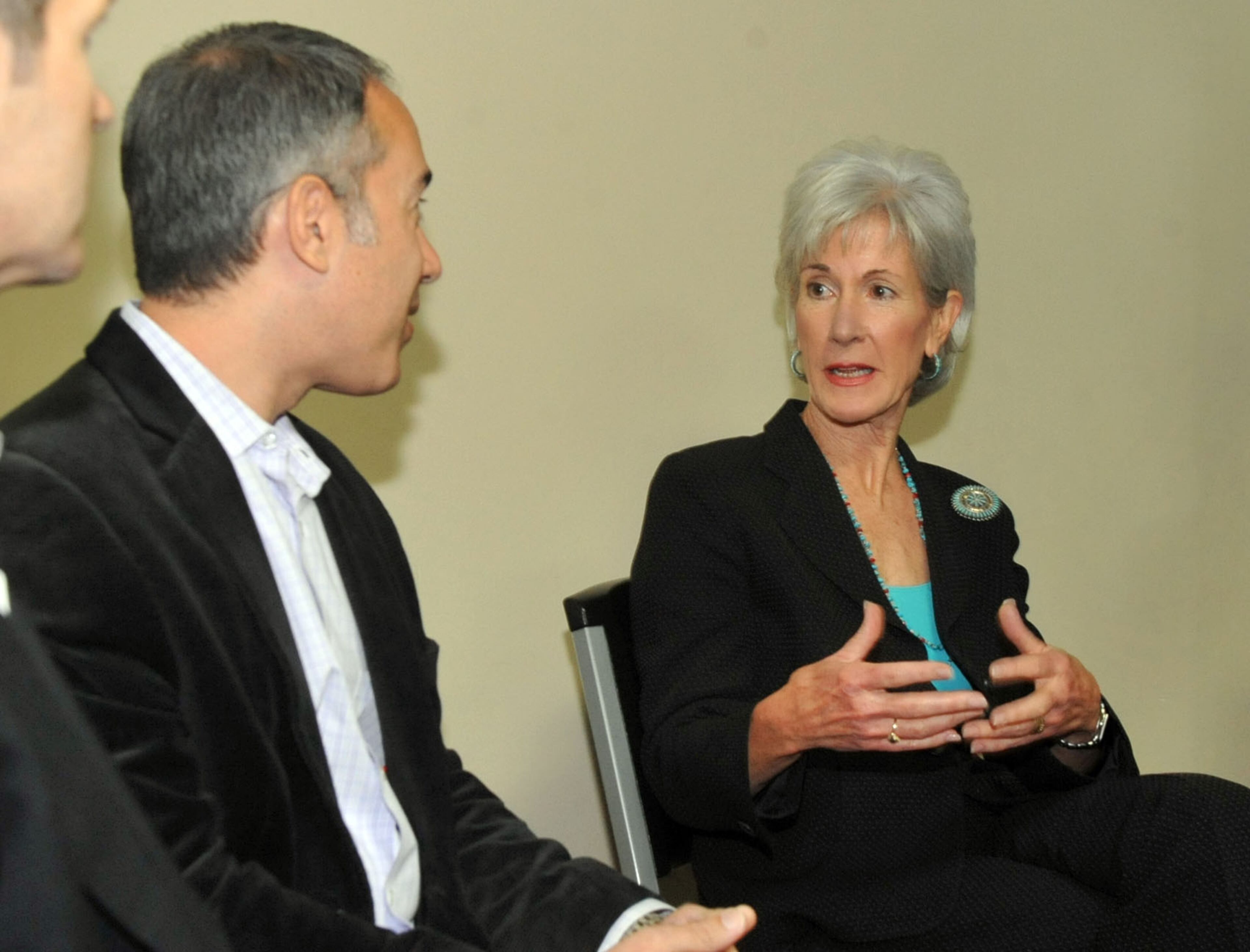 NOVEMBER 8, 2013 ATLANTA Secretary Sebelius talks with Atlanta residents John West (left) and Michael Lappin about their experiences in enrolling for healthcare. HHS Secretary Kathleen Sebelius talks about the Affordable Care Act, dubbed "Obamacare," at the Southside Medical Center in Atlanta, Friday, November 8, 2013. She was in town to discuss enrollment options available to Georgia residents. KENT D. JOHNSON / KDJOHNSON@AJC.COM