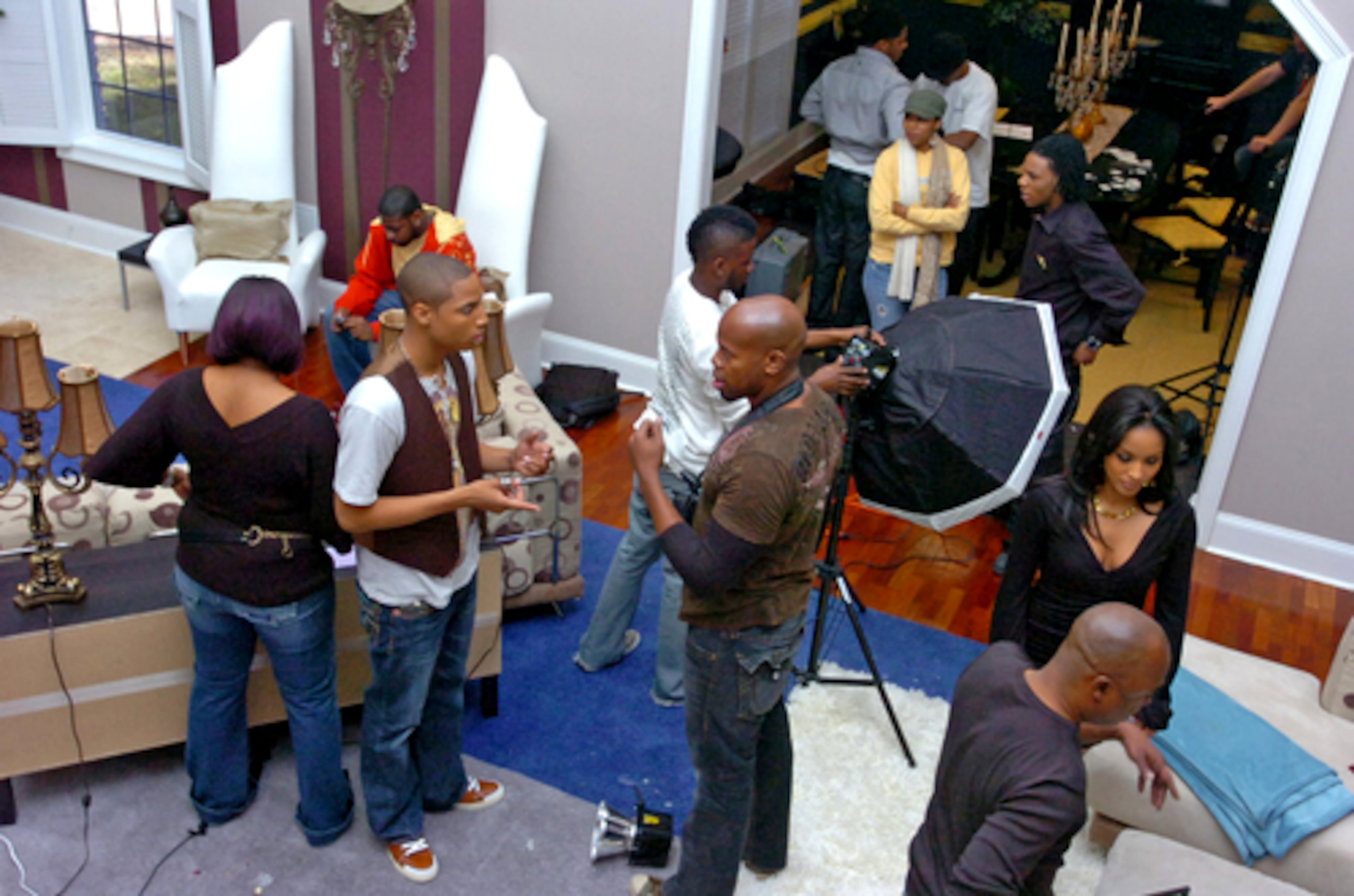 Dorion Standberry (left in the vest) talks with photographer Derek Blanks while Ashley Ragland (bottom right) confers with stylist Olushola Nizam (bottom right). A big chunk of the mansion was used for production and off limits to the contestants. About 50 people were involved in the show. There were five camera crews who shot for nine weeks and compiled 2,300 hours of footage cut down to 13 half-hour episodes.