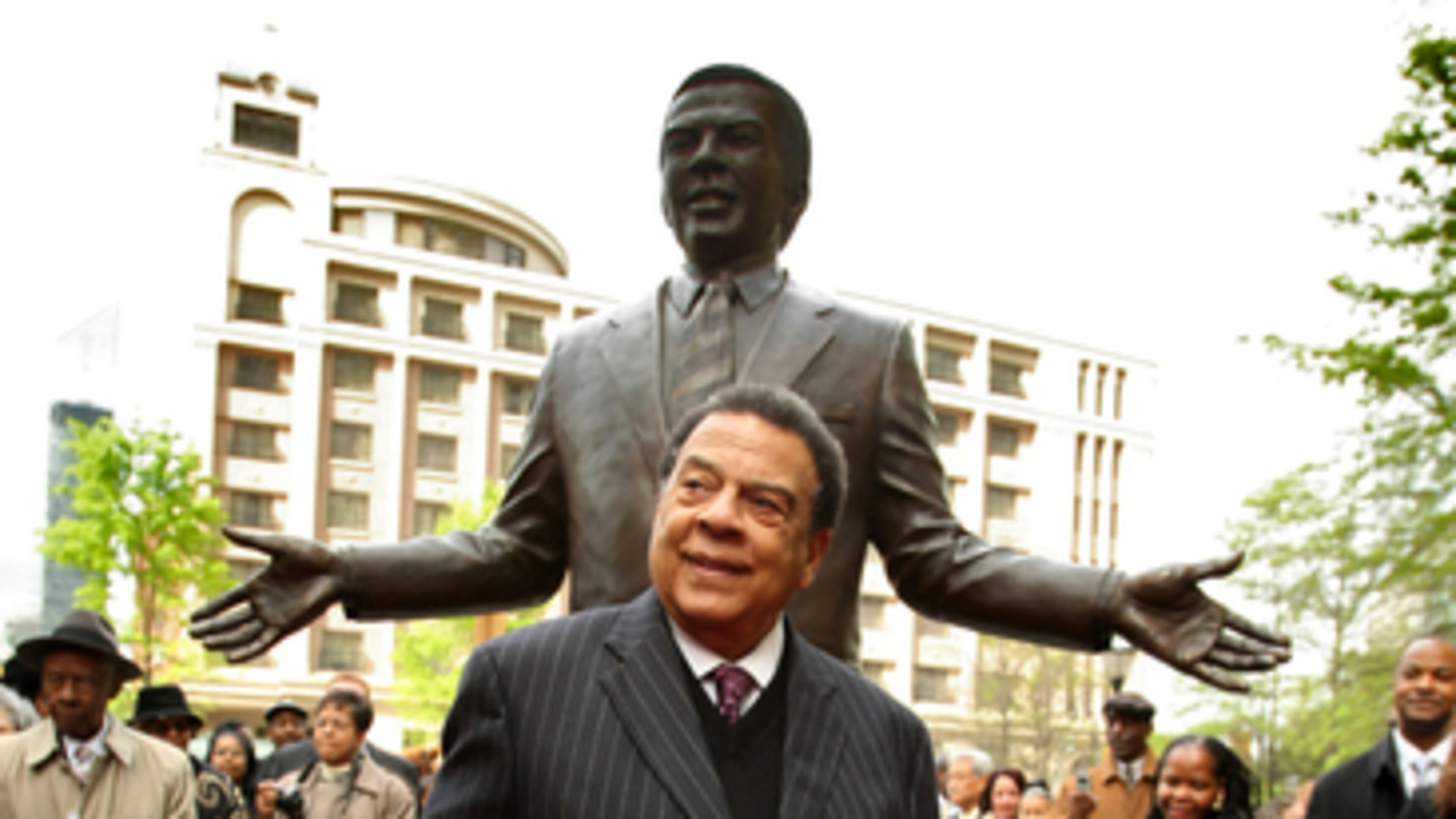 TOPIX 080414 - ATLANTA, FULTON COUNTY- Andrew Young (CQ) along with children from the Andrew and Walter Young Family YMCA pre-school unveil the statue during Monday's ceremony. About 200 people attended a ceremony to dedicate the Andrew Young Monument and Tribute at Walton Spring Park in downtown Atlanta Monday morning. The project which was funded by Aaron Rent's founder, Charles Loudermilk for 1.5 million dollars encapsulates the story of Young's life and his contributions to Atlanta , The U.S., and the world as minister, civil rights leader, mayor, United Nations ambassador and Olympic visionary. Located at Andrew Young International Blvd on e block west of Peachtree St. features a 25-foot obelisk by sculptor, Curtis Patterson anchored to a large bronze disc and a 8 ? bronze statue of Andrew Young by sculptor, johnpaul Harris. Mayor Shirley Franklin, Congressman John Lewis, Charles Loudermilk, CAP Board Chairman, Tom Bell honored Young before the Atlanta political and business leaders who attended. JOHN SPINK / AJC (NOTE- This is an early report - so please follow with reporter for updates) (COPY DESK - Call Spink at 678-984-3053 (cell) or page him at 1-888-624-9904 During the hours of 6AM to 4PM Monday thru Friday or call him at home After 5PM 770-784-7421 for questions) # 65317