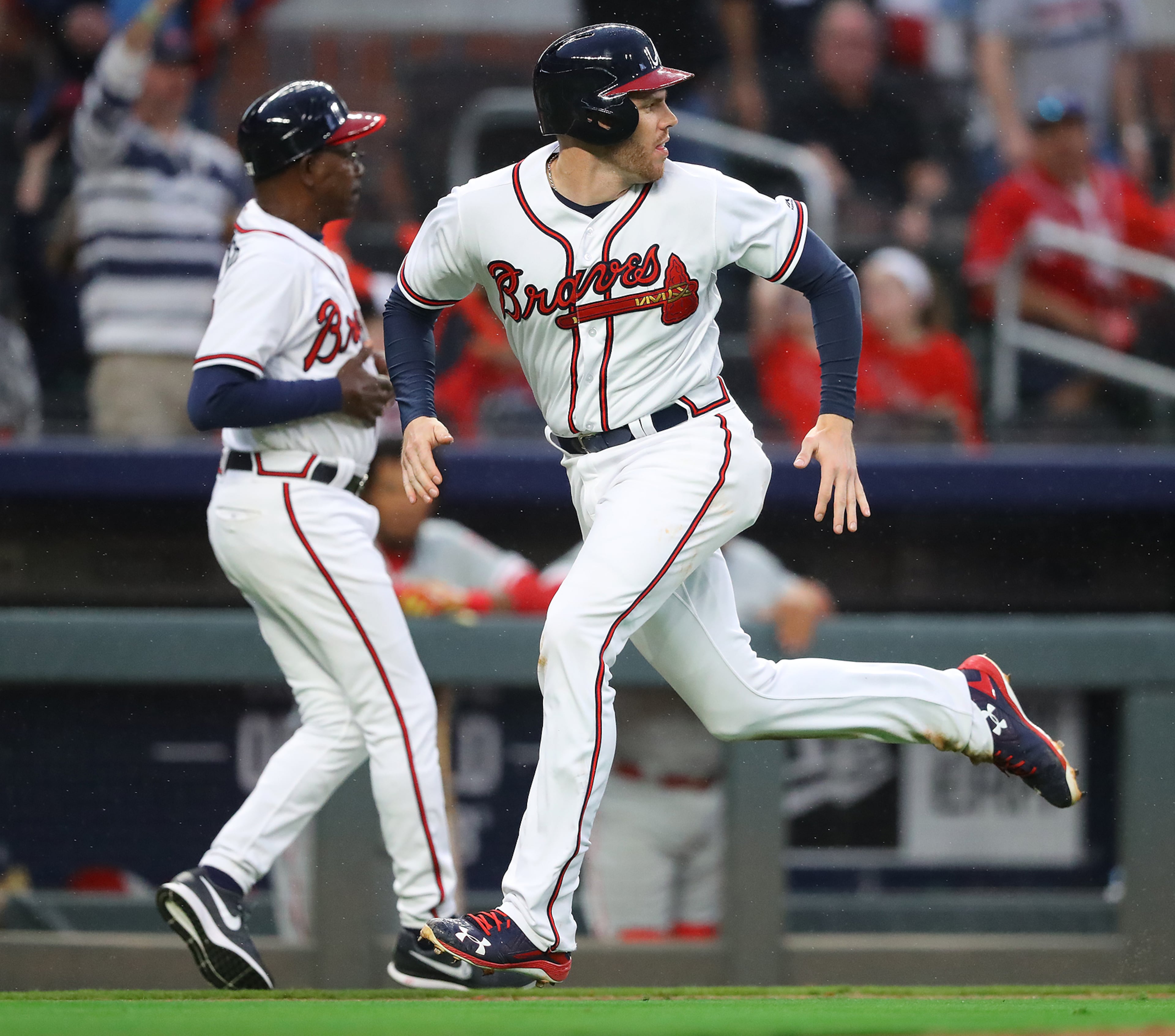 March 29, 2018 Atlanta: Atlanta Braves Freddie Freeman scores from second base on a wild pitch that advanced him to third and a errant throw to third sending him home during the eight inning against the Phillies in a MLB baseball home opening game on Thursday, March 29, 2018, in Atlanta. Curtis Compton/ccompton@ajc.com