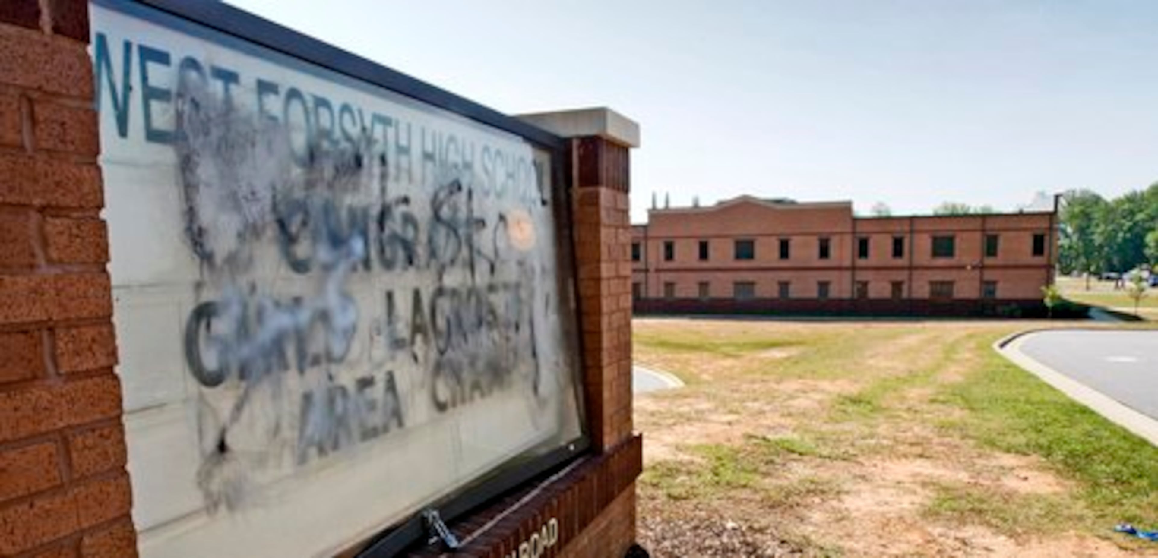 Forsyth County schools spokeswoman Jennifer Caracciolo told the AJC the graffiti stretches from one side of the school to the other.