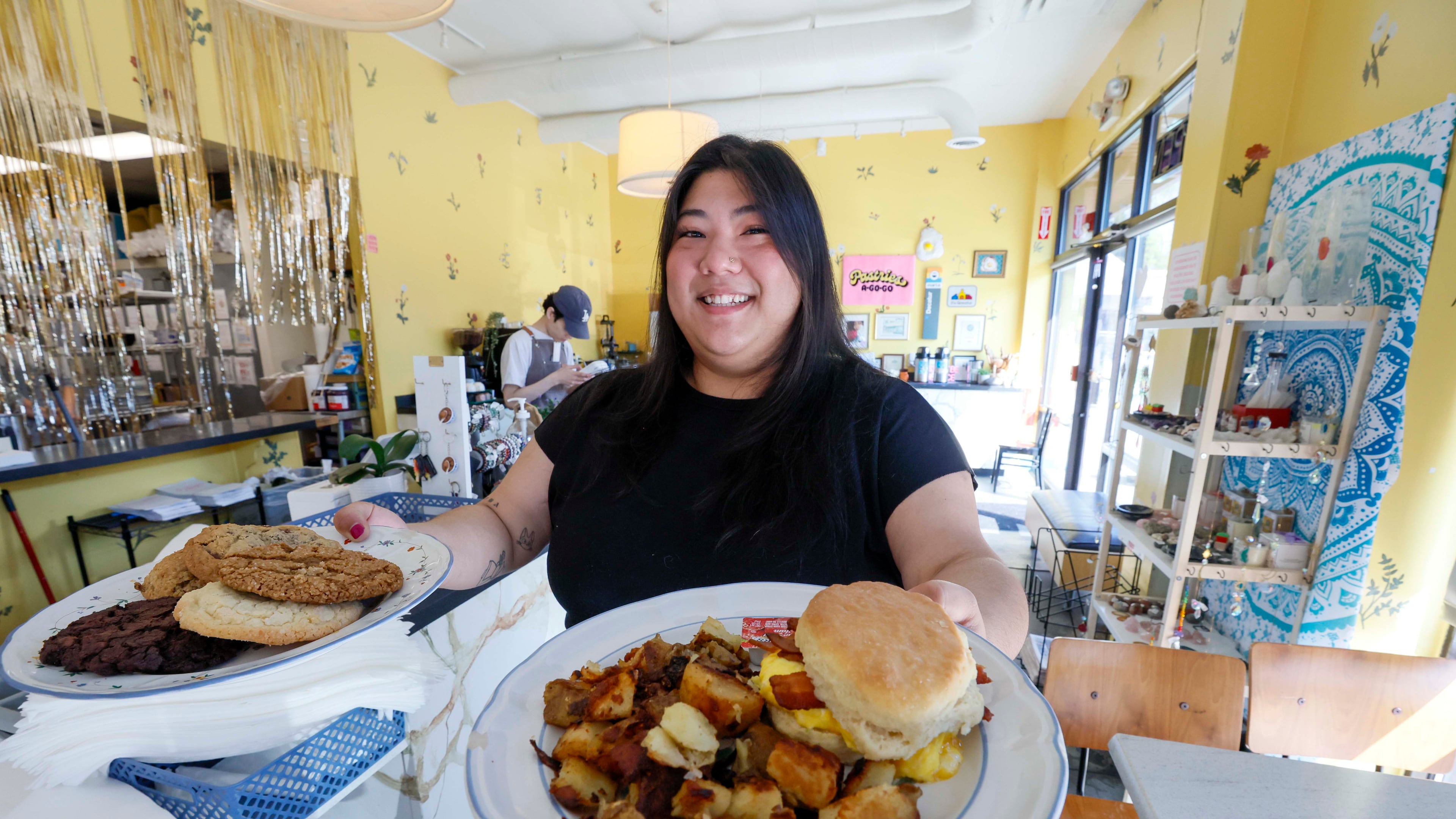 Adriana Park, owner of Pastries A Go Go, displays a couple of their signature dishes on Thursday, March 26, 2026. Since taking over the establishment two years ago, she has infused her daily interactions with customers with a distinctive sense of joy and a fresh approach. (Miguel Martinez/AJC)