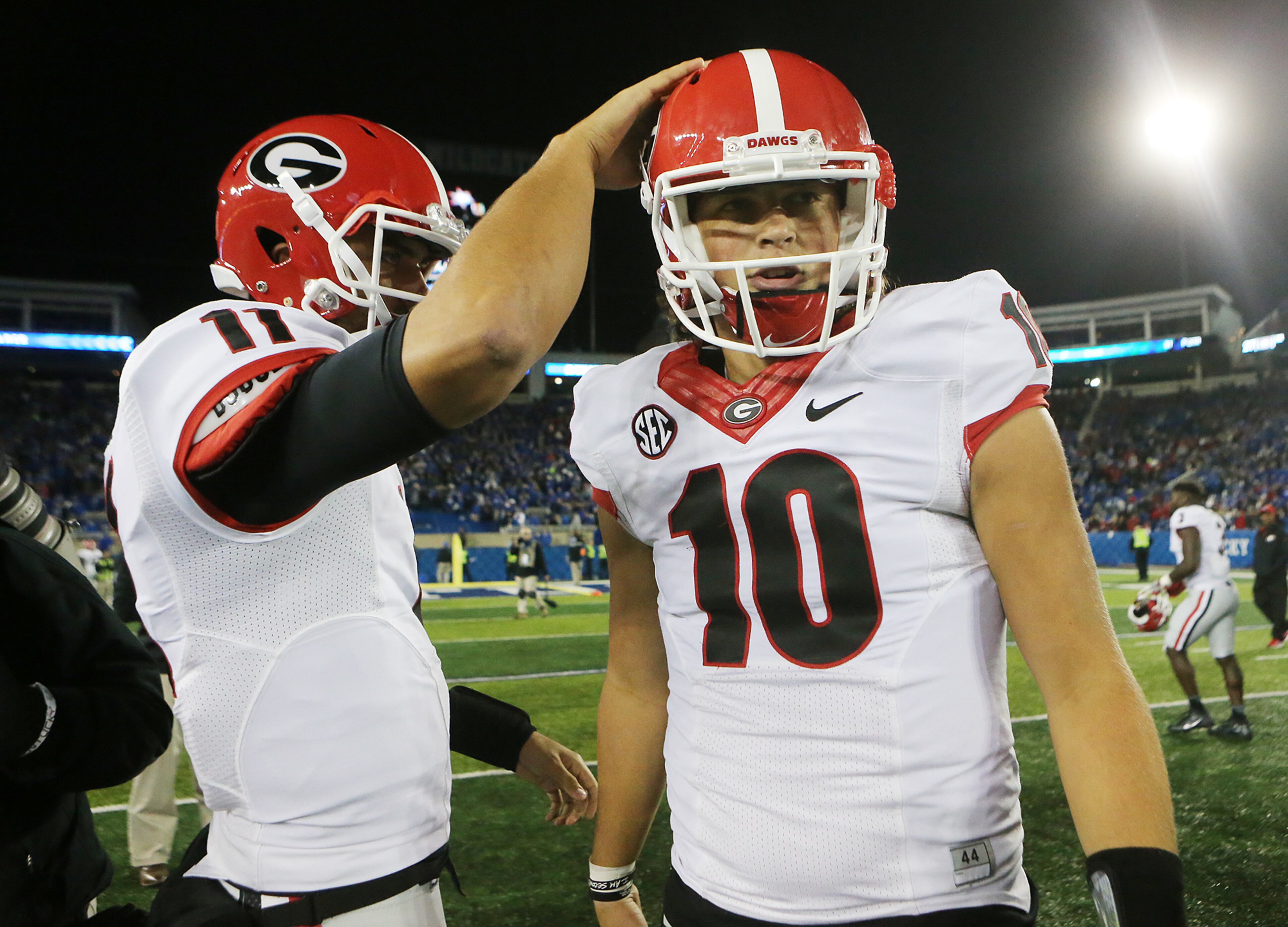 November 5, 2016, LEXINGTON: Georgia quarterback Jacob Eason gets a pat on the helmet from backup quarterback Greyson Lambert after beating Kentucky 27-24 in an NCAA college football game on Saturday, Nov. 5, 2016, in Lexington. Curtis Compton /ccompton@ajc.com
