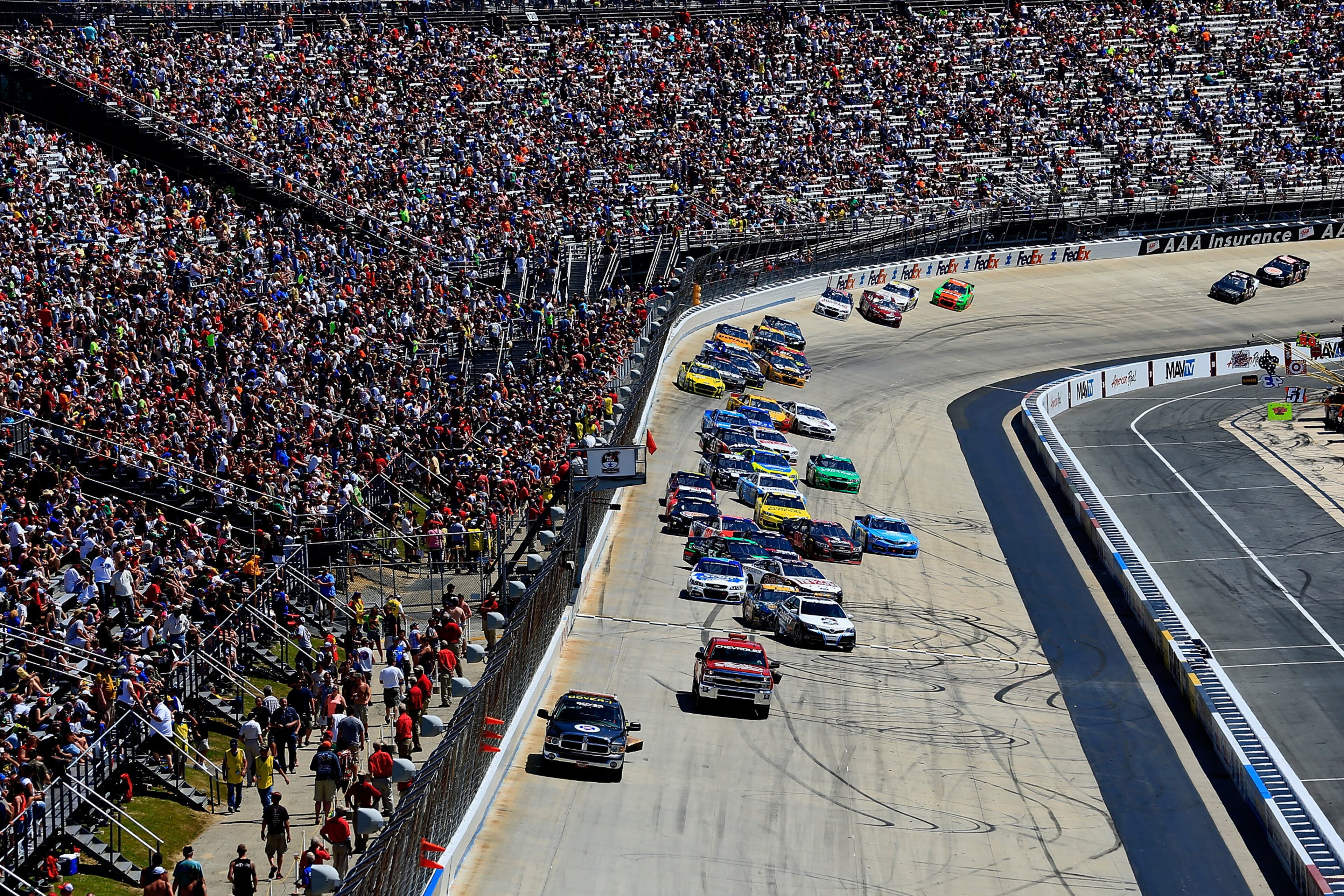 Cars stop on track during a red flag caused by damage to the track during the NASCAR Sprint Cup Series FedEx 400 Benefiting Autism Speaks at Dover International Speedway on June 1, 2014 in Dover, Delaware. (Photo by Rob Carr/Getty Images)