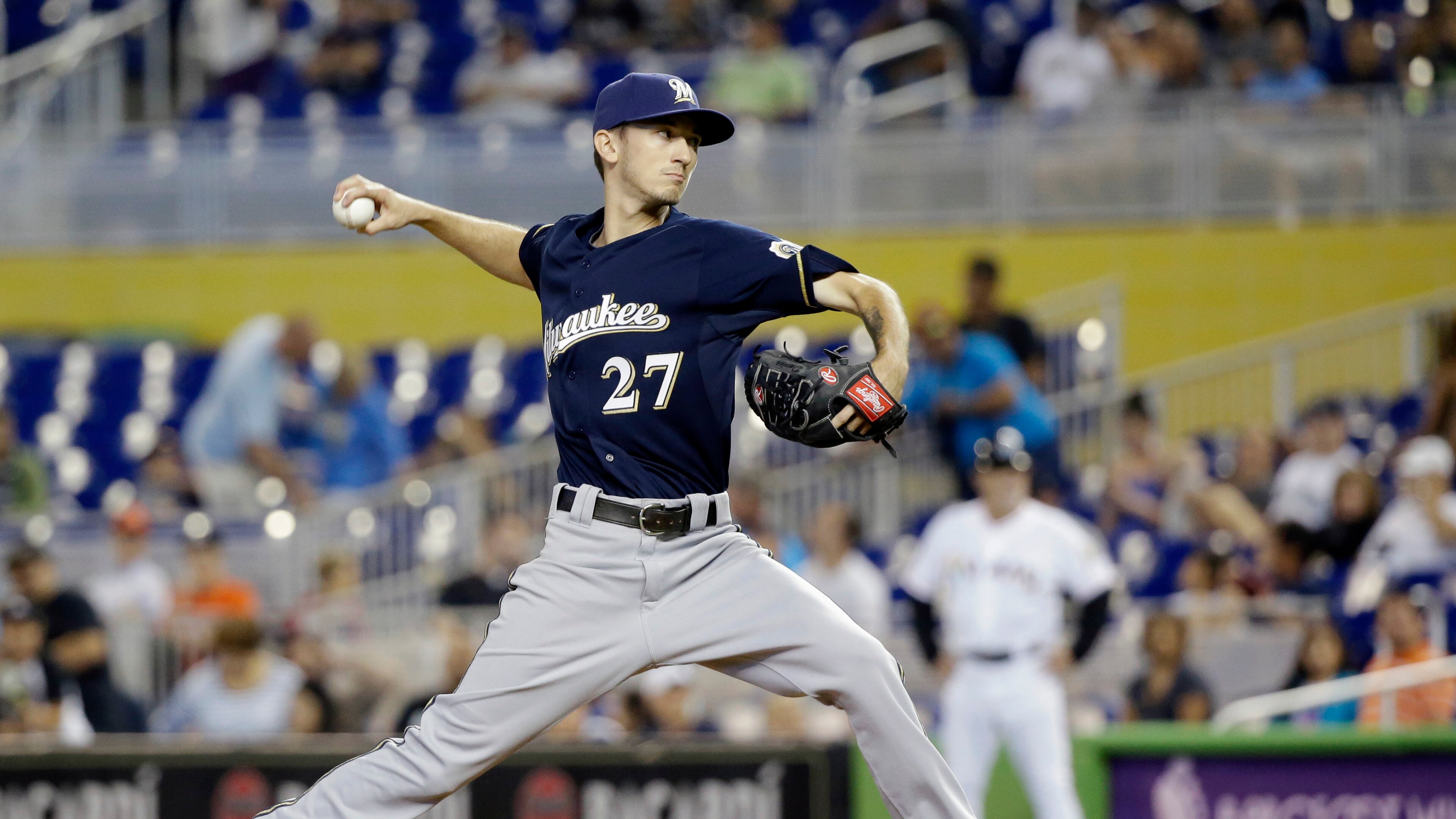 Milwaukee Brewers' Zach Davies delivers a pitch during the seventh inning of a baseball game against the Miami Marlins, Monday, Sept. 7, 2015, in Miami. Davies earned his first major league win as the Brewers defeated the Marlins 9-1. (AP Photo/Wilfredo Lee)
