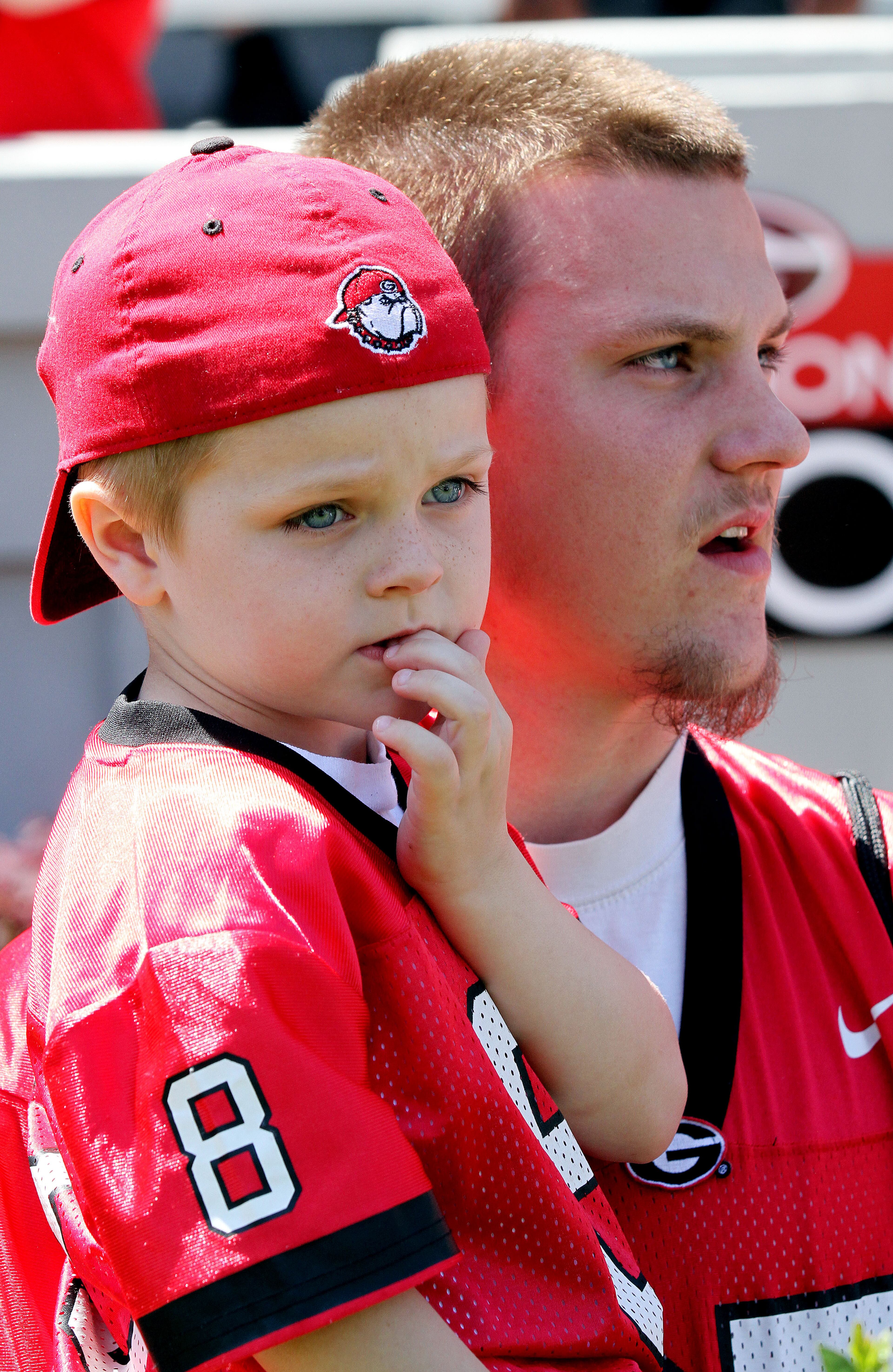 Five-year-old Michael Hyatt & his father Josh wait for UGA's G-Day football game to begin at Sanford Stadium in Athens.