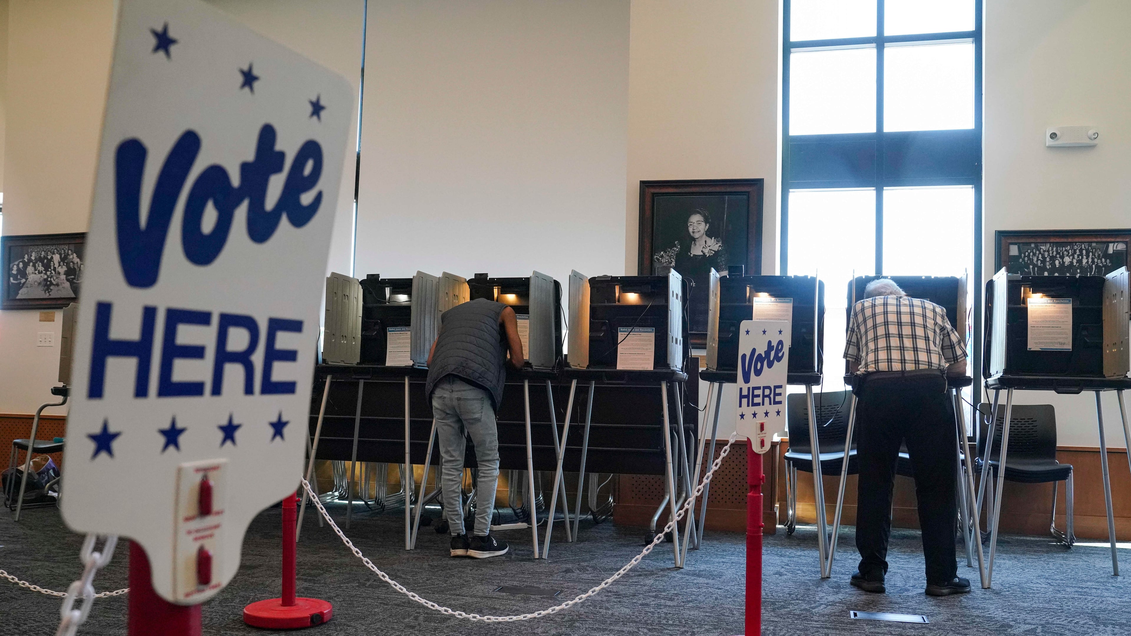 People vote in the Democratic primaries at Blair-Caldwell Library, Tuesday, June 30, 2026, in Denver. (AP Photo/Rebecca Slezak)
