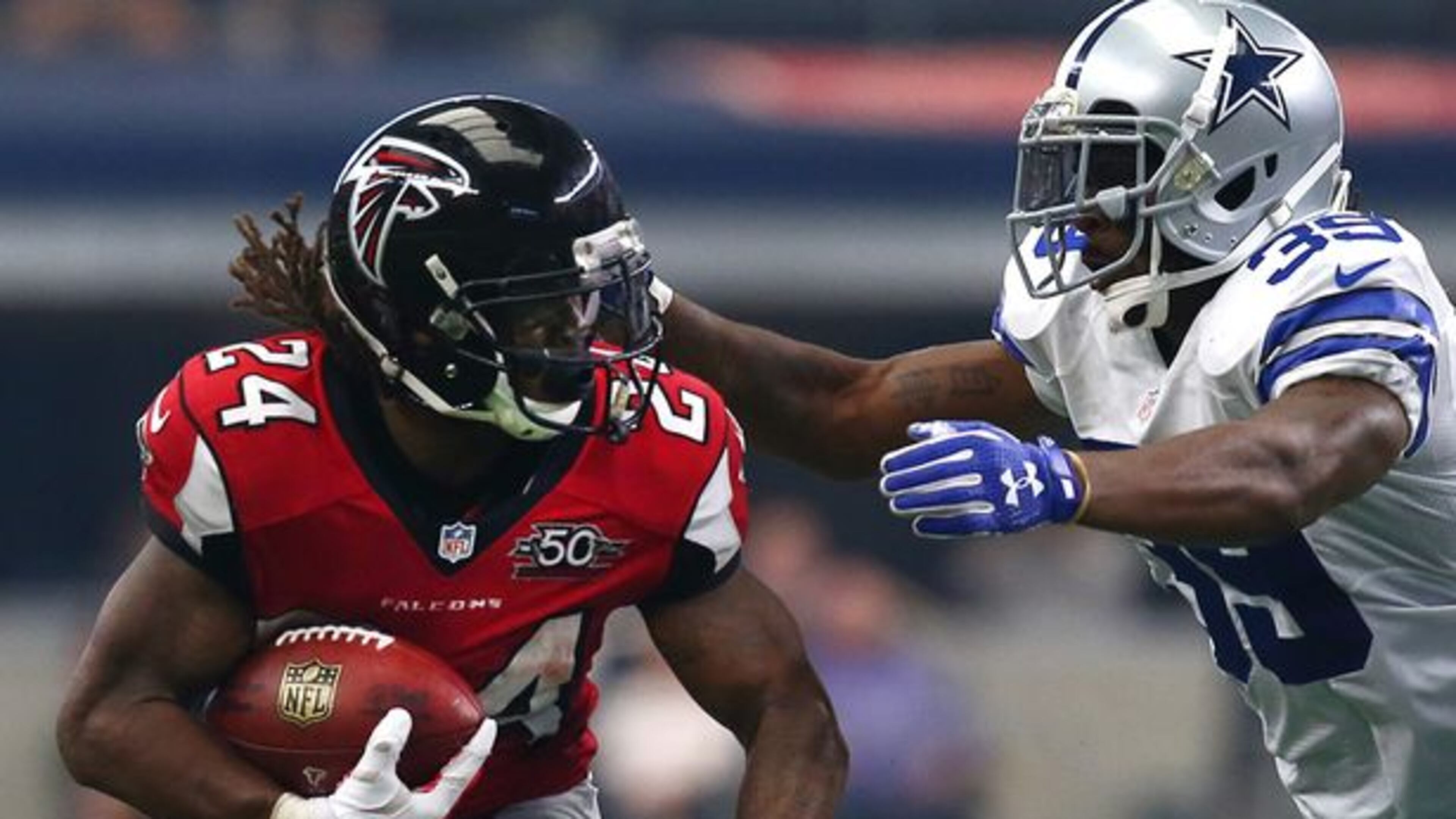 ARLINGTON, TX - SEPTEMBER 27: Devonta Freeman #24 of the Atlanta Falcons is pursued by Brandon Carr #39 of the Dallas Cowboys in the second quarter at AT&T Stadium on September 27, 2015 in Arlington, Texas. (Photo by Tom Pennington/Getty Images)