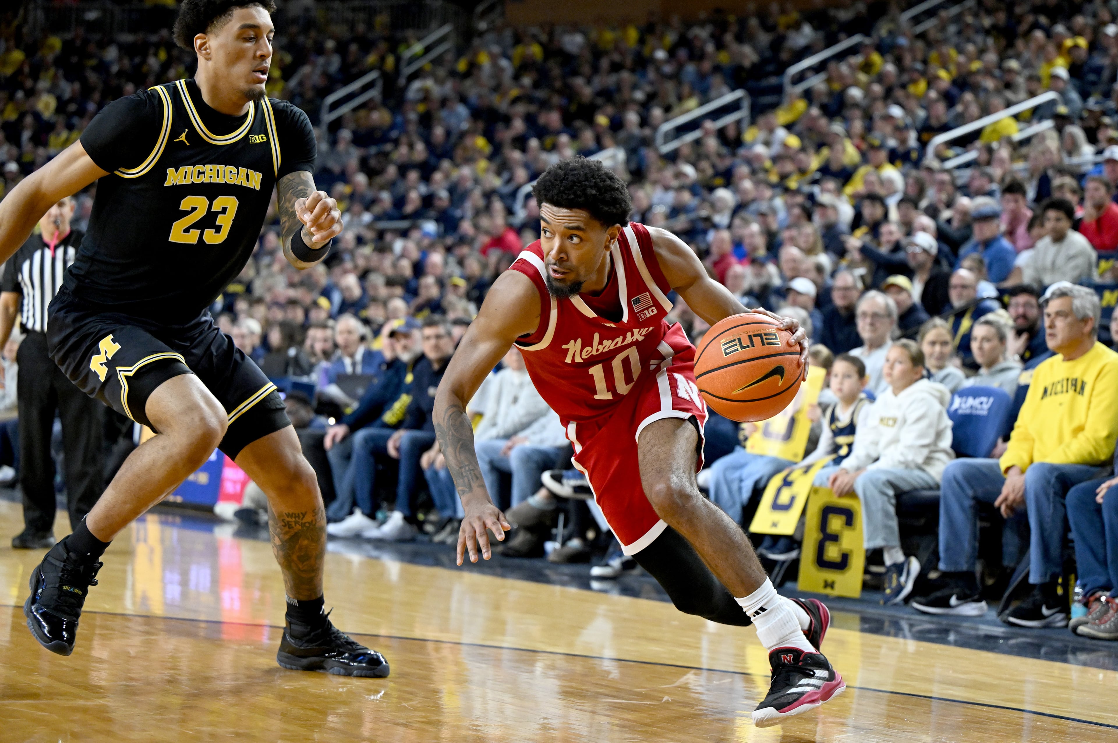 Nebraska guard Jamarques Lawrence (10), Michigan forward Yaxel Lendeborg (23)