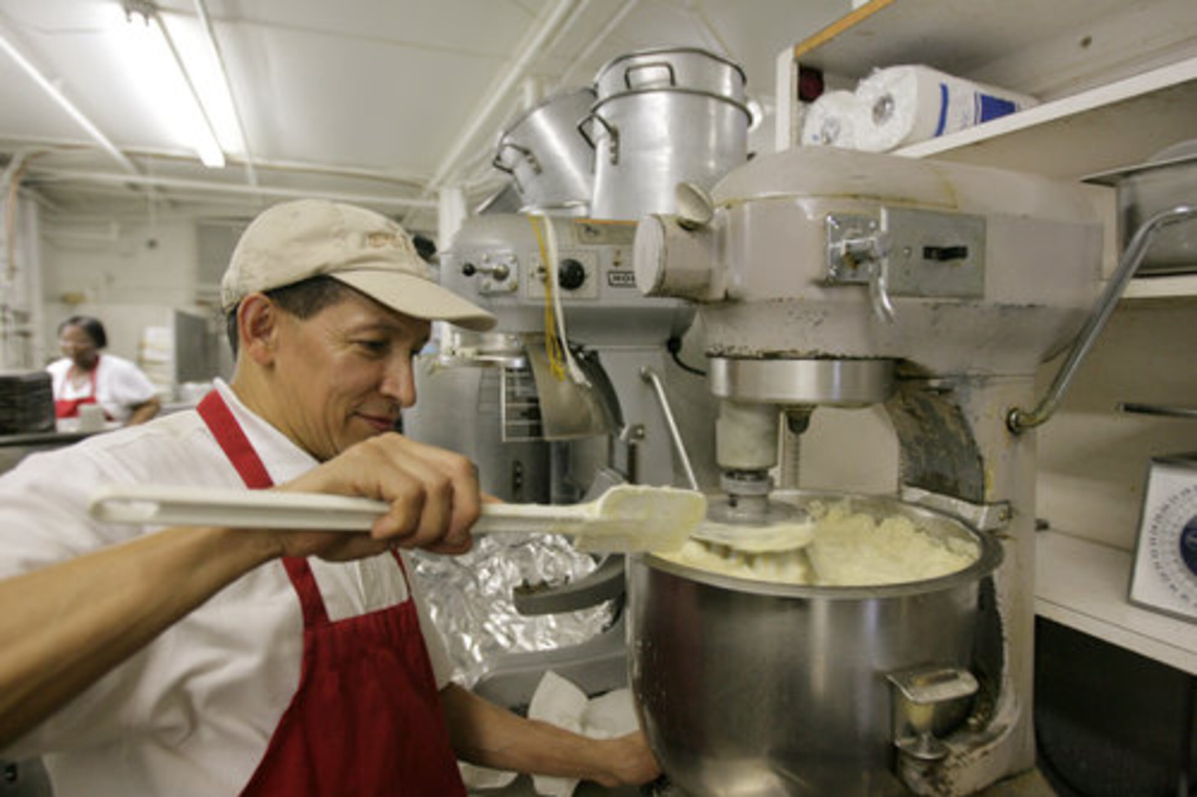 Oscar Lazo uses an industrial mixer to whip up mashed potatoes, which like the rest of the menu are made from scratch with no preservatives.