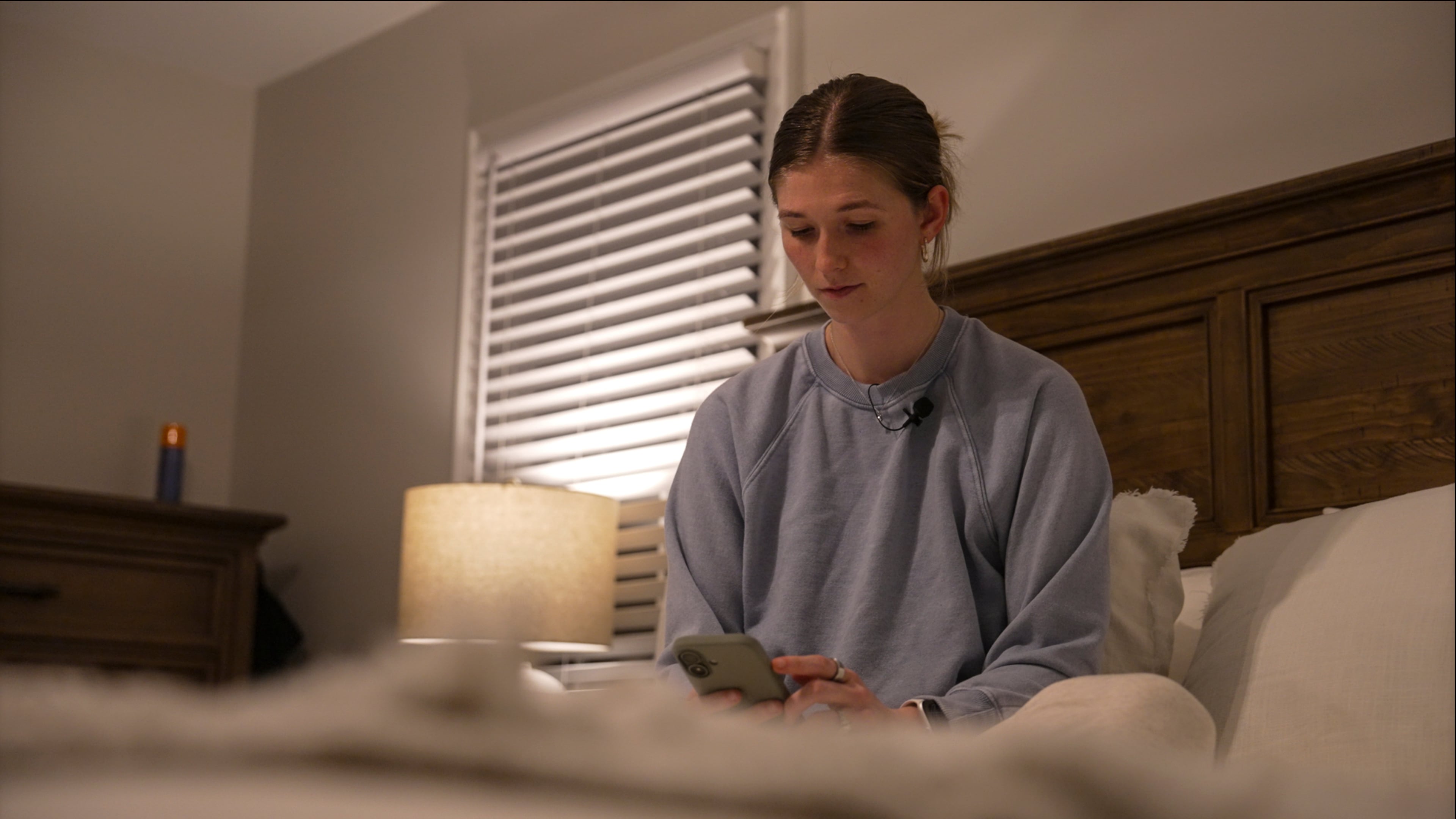 Middle school teacher Kate Stoye checks her sleep score on her phone, Wednesday, Jan. 7, 2026, in Hiram, Ga. (AP Photo/Emilie Megnien)