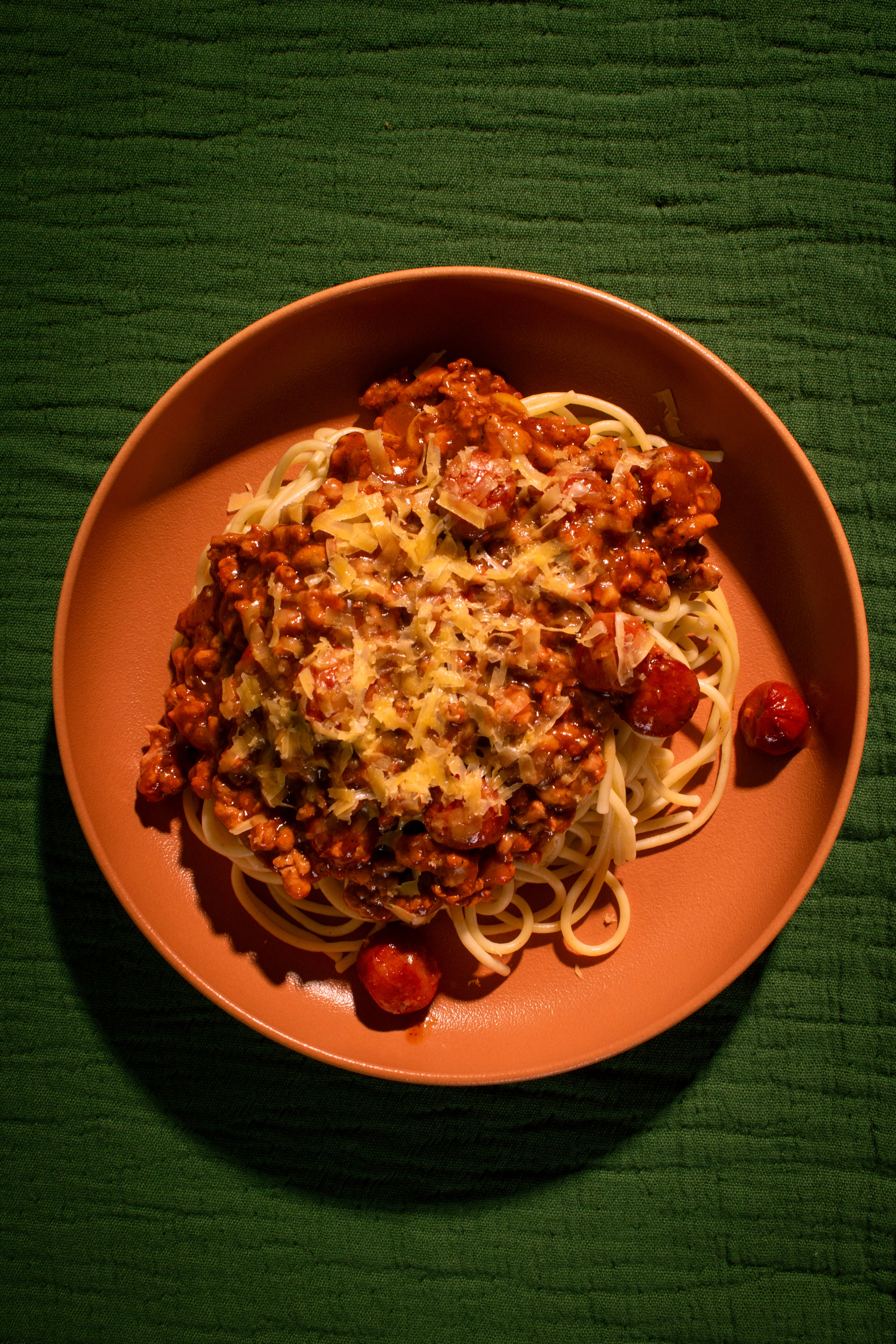 The Filipino family-style benefit dinner from Manalo’s Bakery includes sweet Filipino spaghetti topped with cheese. (Courtesy of Matthew Macasieb)